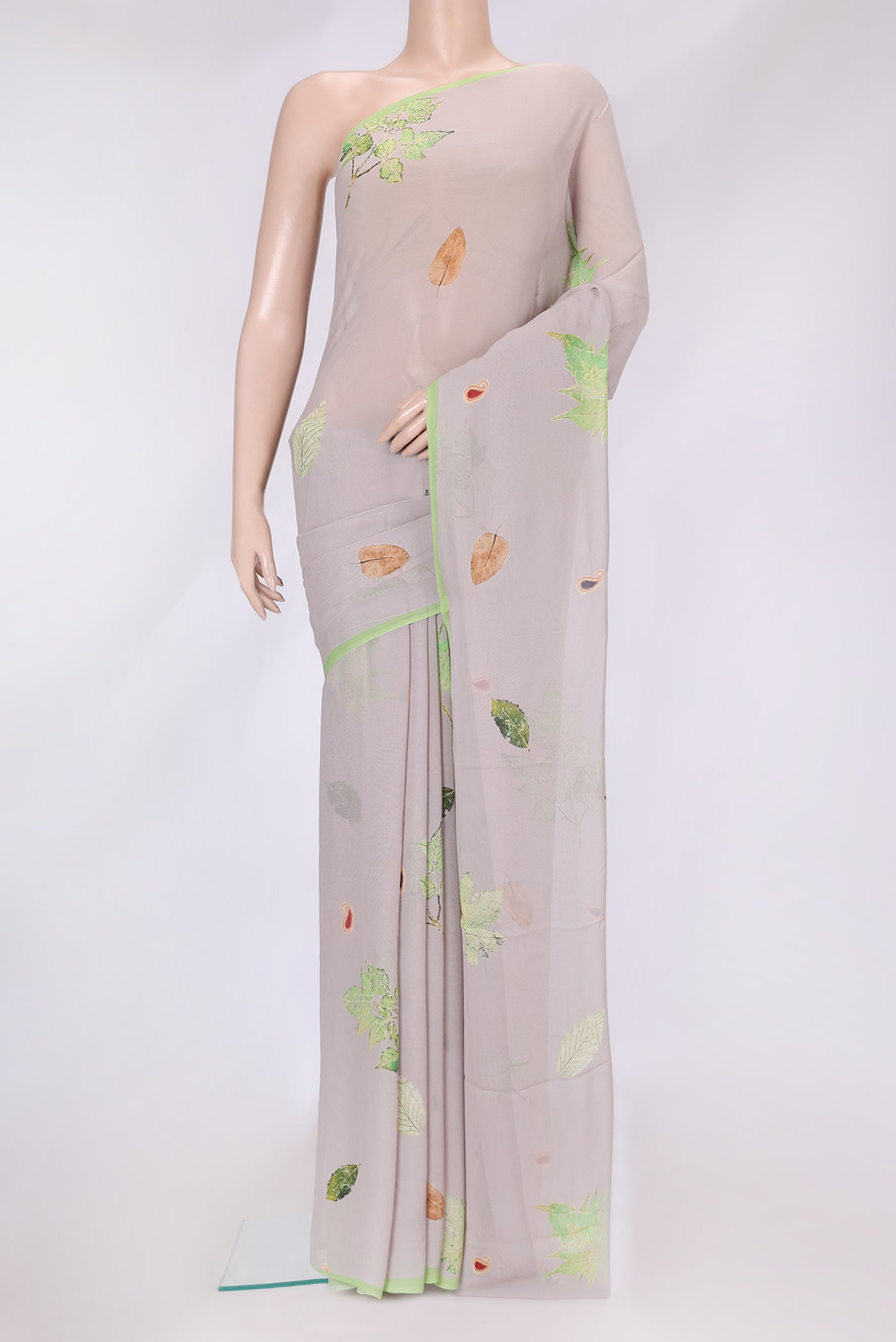 Grey Dual Tone Mysore Georgette Saree with Printed design on the body and Without Border.  displayed on a mannequin