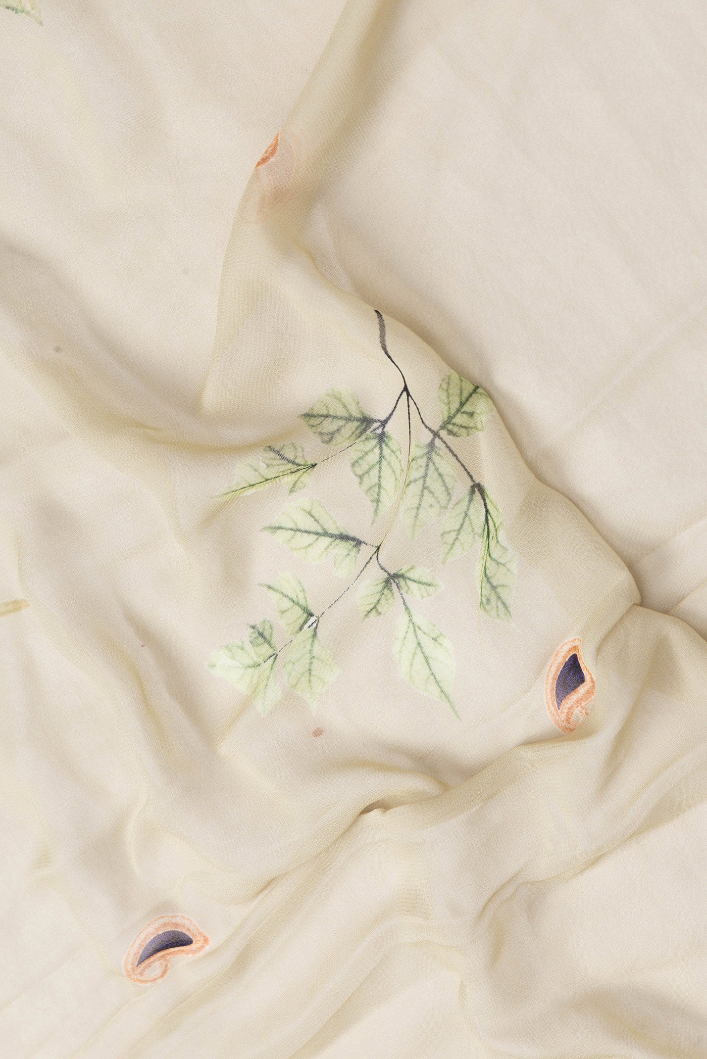 Close up of Pista Green Dual Tone Georgette Saree with Printed design on the body and Fancy Border.  displaying folds