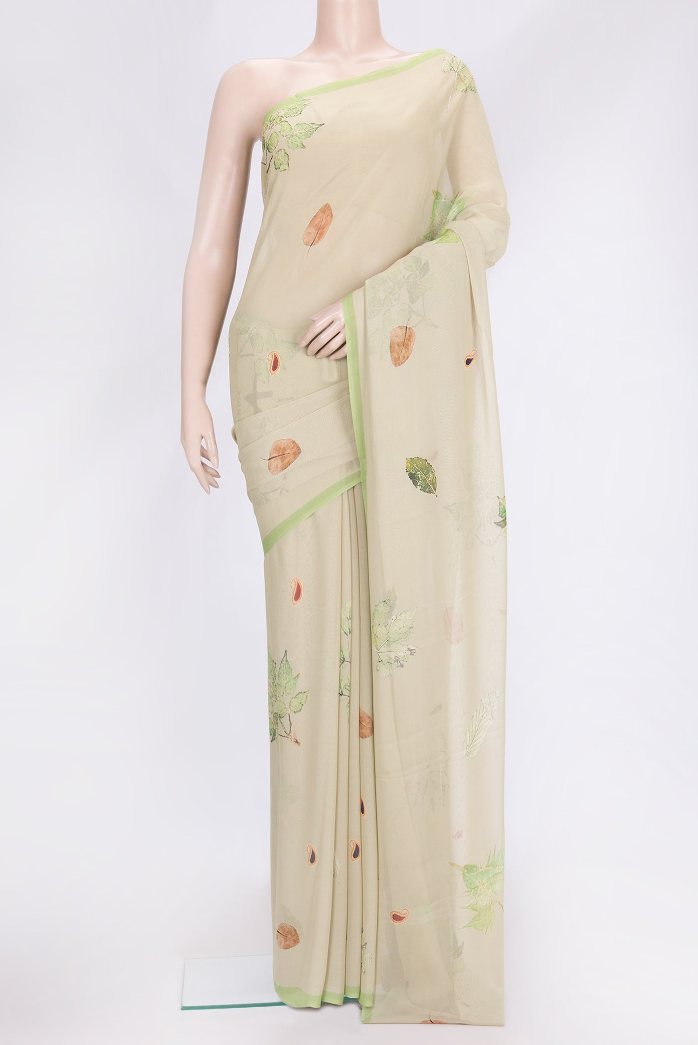 Pista Green Dual Tone Georgette Saree with Printed design on the body and Fancy Border.  displayed on a mannequin
