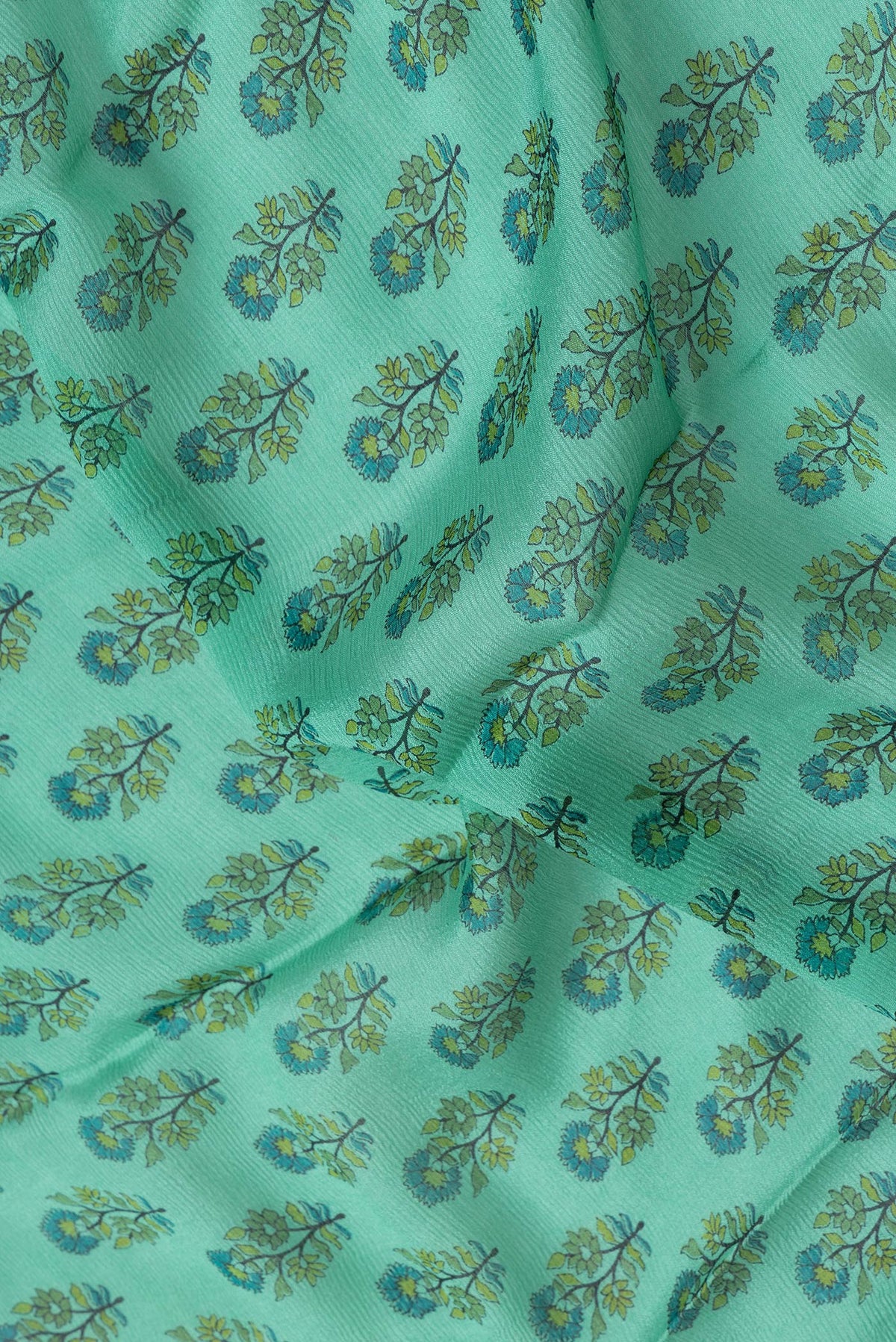 Close up of Sea Green Dual Tone Mysore Chiffon Saree with Printed design on the body and Thin Zari Line.  displaying folds
