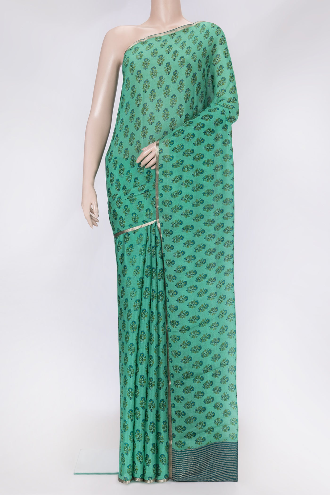 Sea Green Dual Tone Mysore Chiffon Saree with Printed design on the body and Thin Zari Line.  displayed on a mannequin