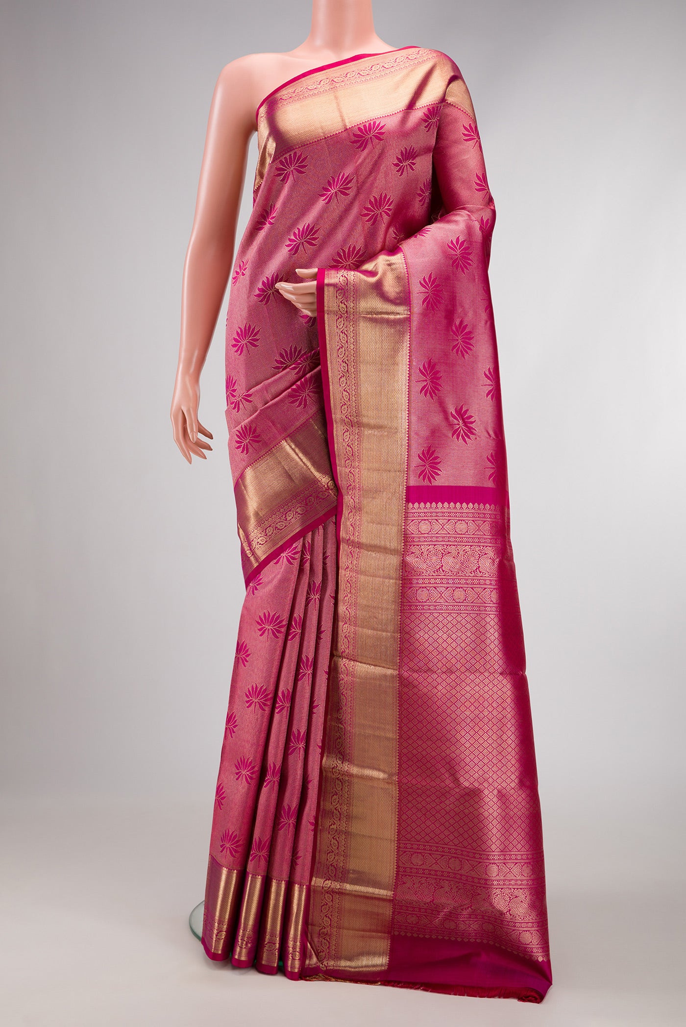 Pink Dual Tone Kanchipuram Silk Saree with Zari Brocade on the body and Zari Border.  displayed on a mannequin