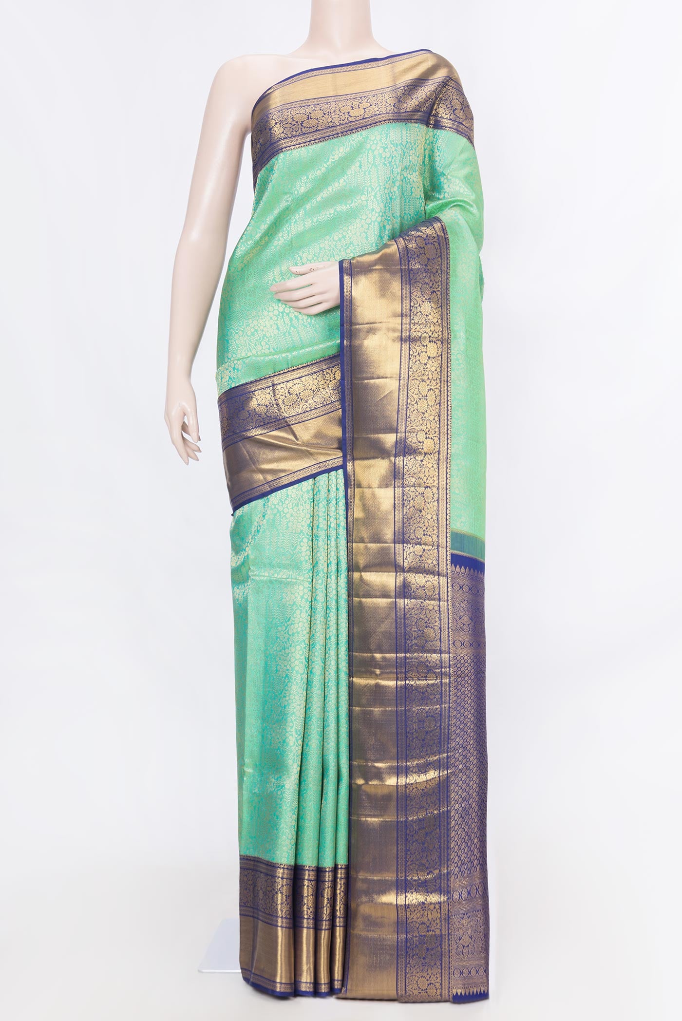 Sea Green Dual Tone Kanchipuram Silk Saree with Zari Brocade on the body and Zari Border displayed on a mannequin