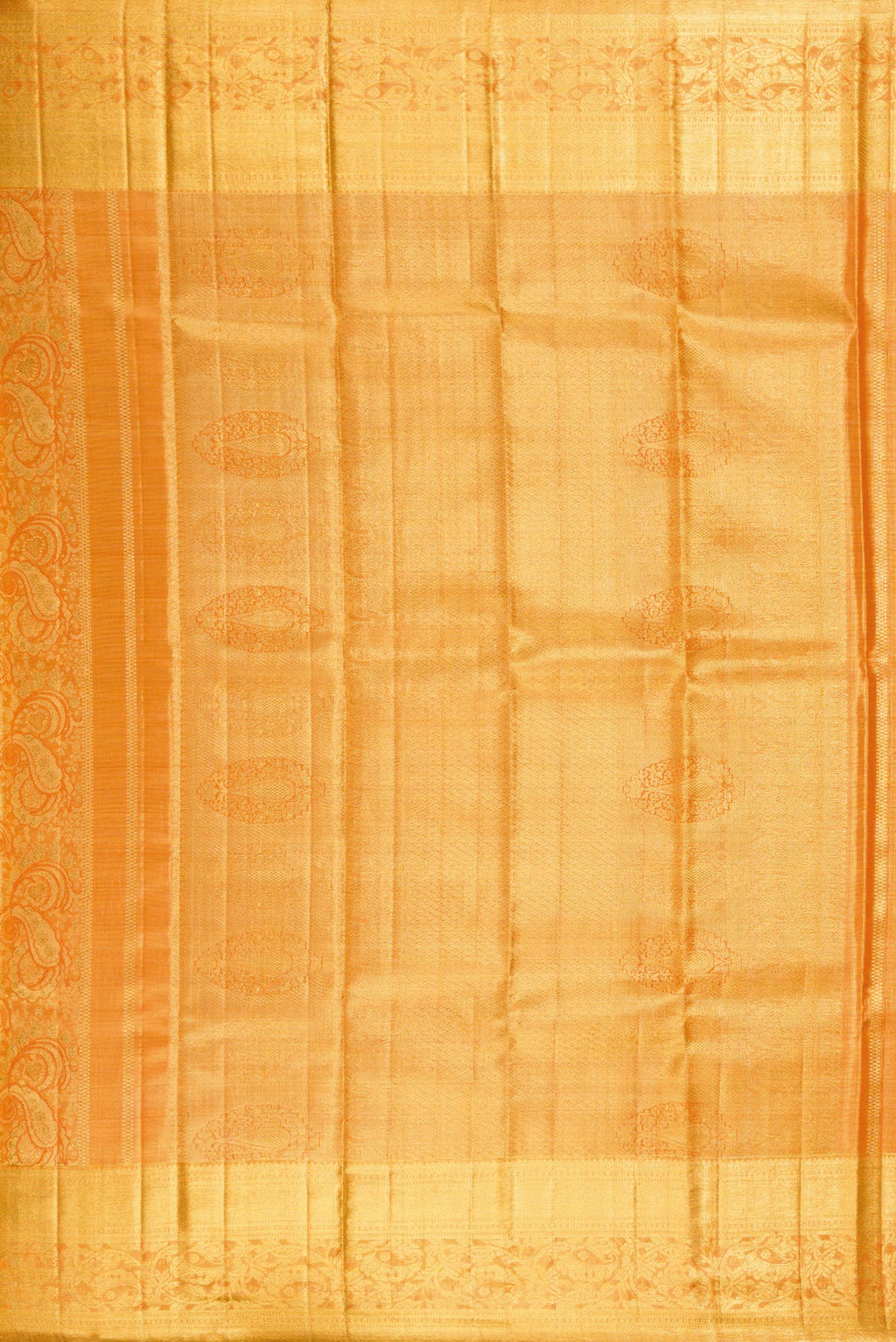 Close up image of the pallu of Orange Dual Tone Kanjivaram Tissue Silk Saree with Zari Brocade on the body and Zari Border. 
