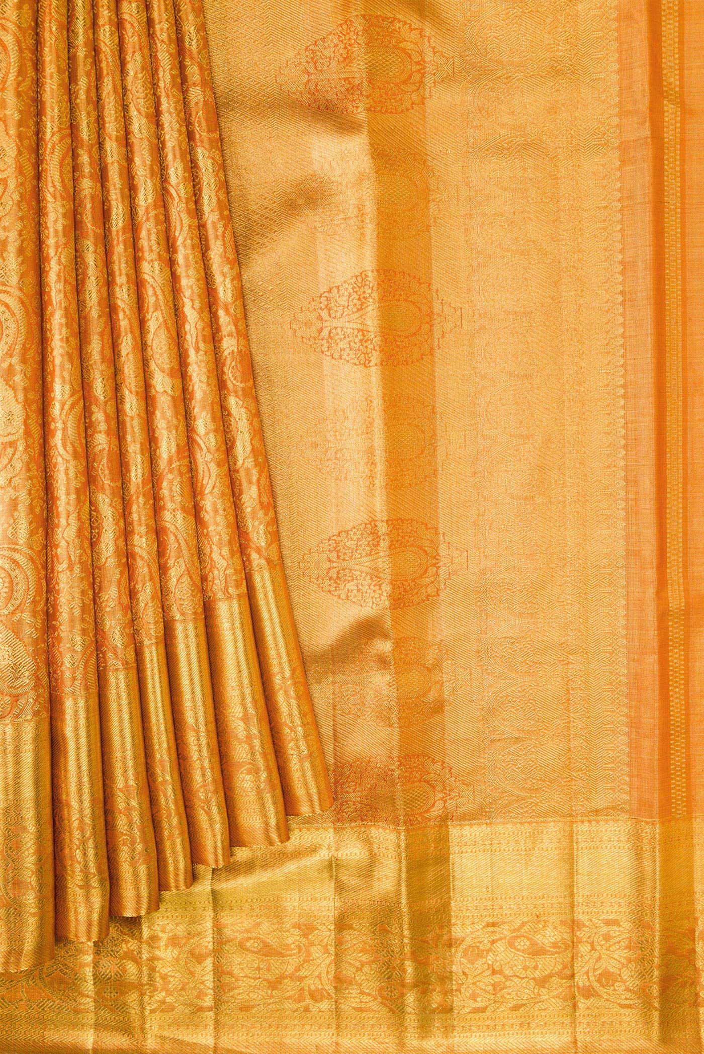 Pleats and pallu of Orange Dual Tone Kanjivaram Tissue Silk Saree with Zari Brocade on the body and Zari Border. 
