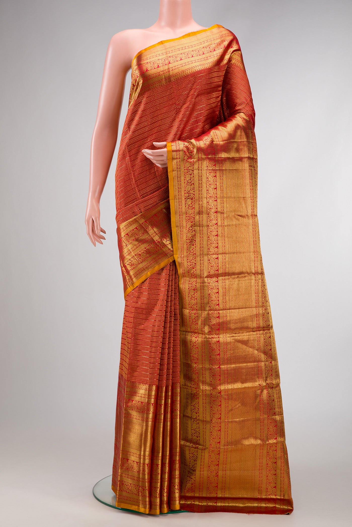 Maroon Dual Tone Kanchipuram Silk Saree with Zari Brocade on the body and Zari Border.  displayed on a mannequin