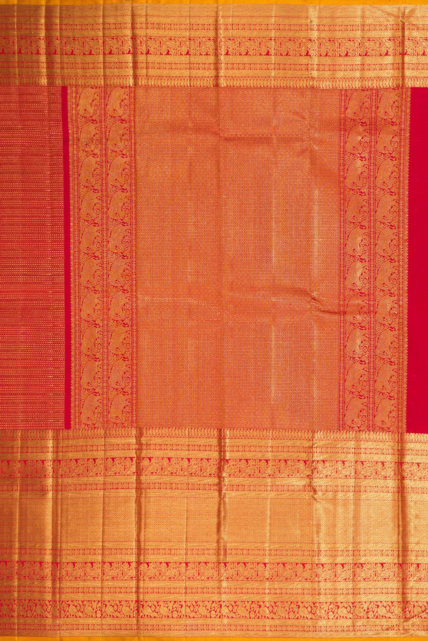 Close up image of the pallu of Maroon Dual Tone Kanchipuram Silk Saree with Zari Brocade on the body and Zari Border. 
