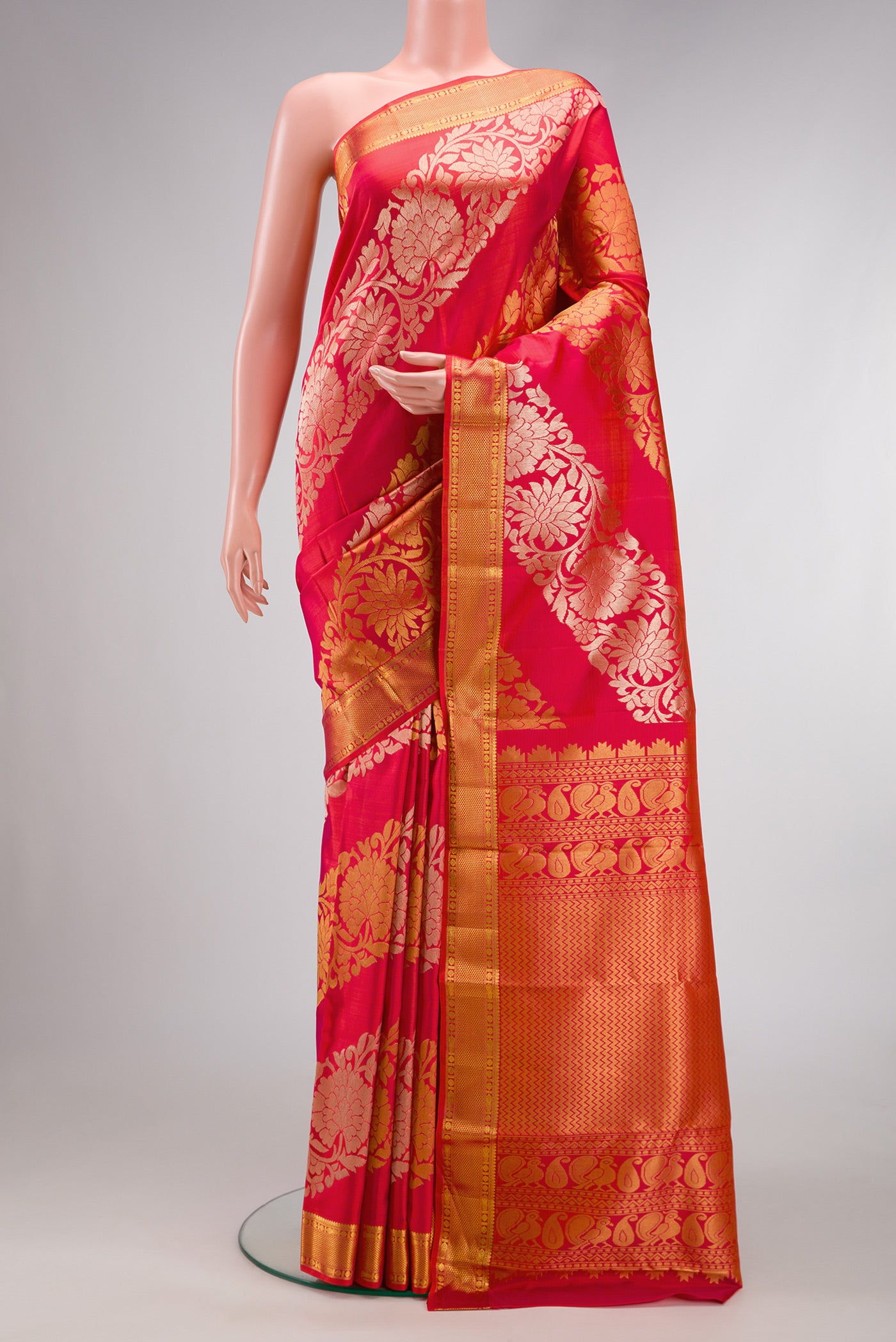 Coral Dual Tone Kanchipuram Silk Saree with Zari Brocade on the body and Zari Border.  displayed on a mannequin