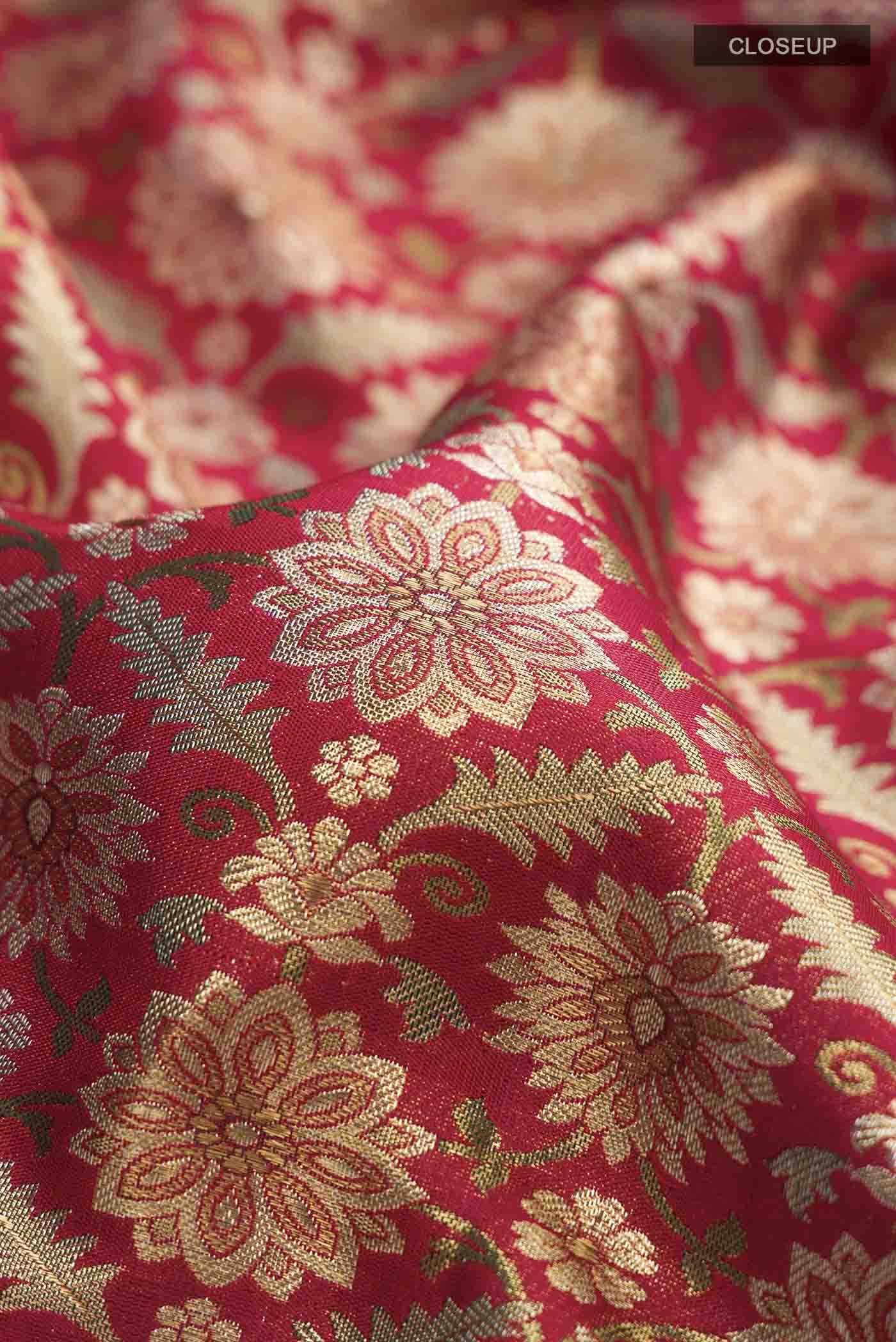 Close up of Red Kanchipuram Silk Saree with Zari Brocade on the body and Zari Border displaying folds