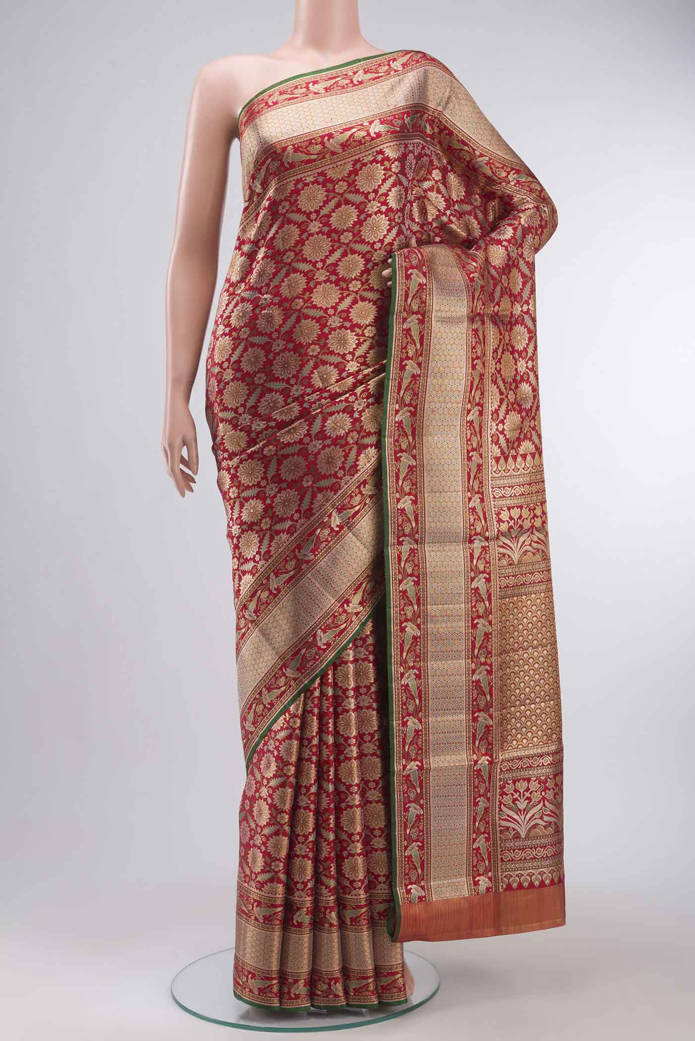 Red Kanchipuram Silk Saree with Zari Brocade on the body and Zari Border displayed on a mannequin