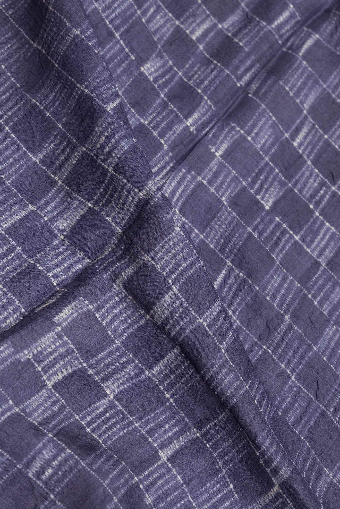 Close up of Navy Blue Dual Tone Tussar Saree with Checked design on the body and Zari Border.  displaying folds