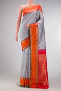 Pure Silk Pure Zari Grey Dual Tone Kanchipuram Saree with Thread Butta on the body and Zari Border.  displayed on a mannequin