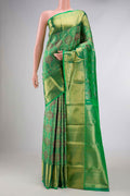 Green Dual Tone Kanchipuram Saree with Zari Brocade on the body and Zari Border displayed on a mannequin