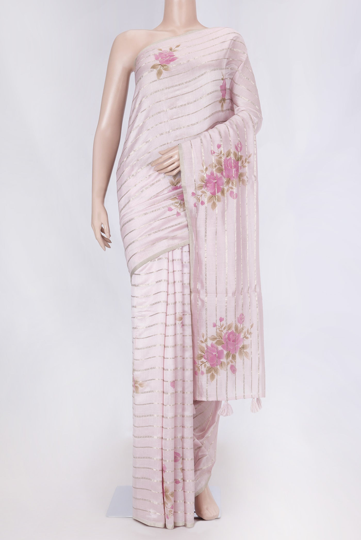 Rose pink Tussar Silk Saree with Stripes on the body and Thin Zari Line displayed on a mannequin