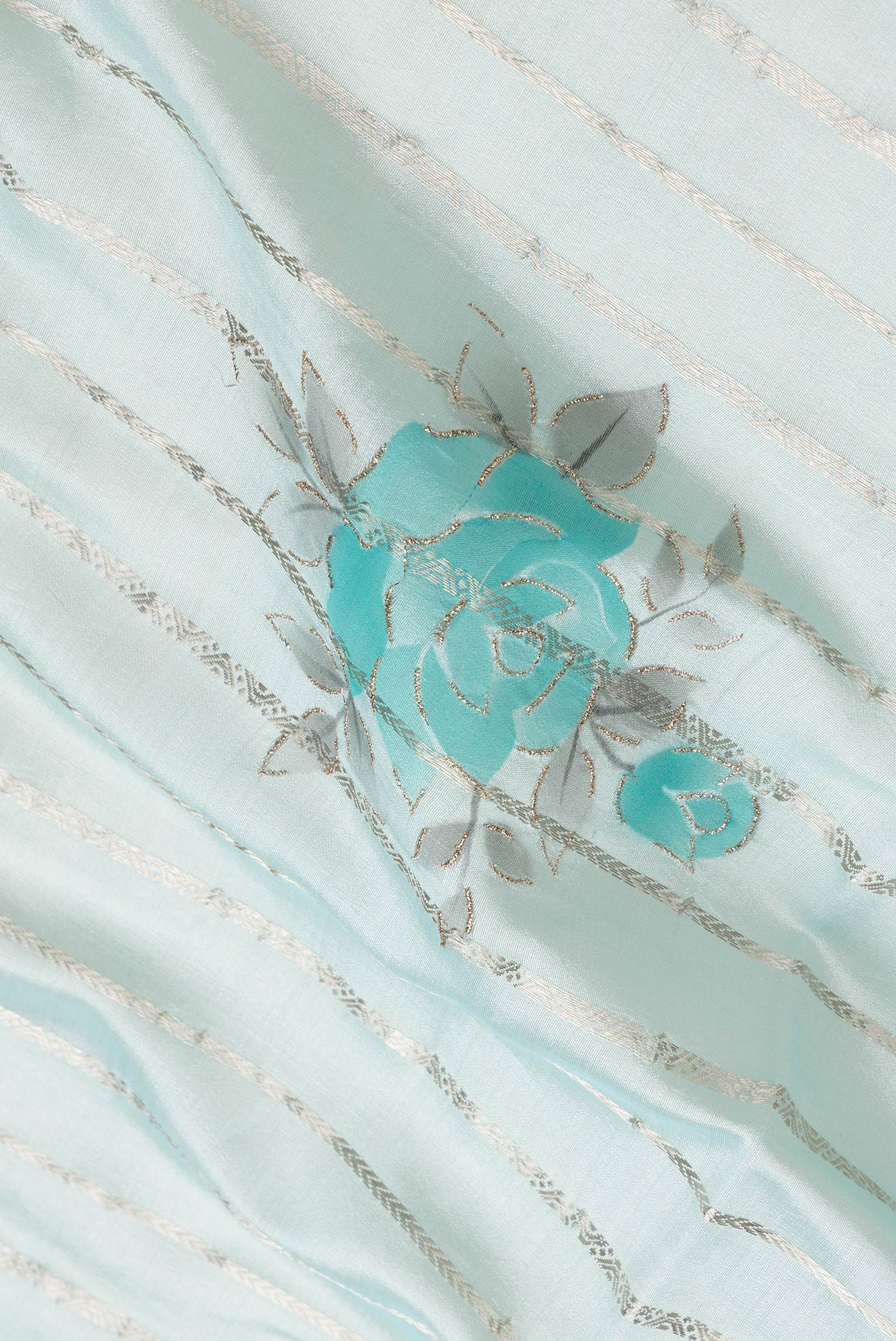 Close up of Sky Blue Dual Tone Tussar Silk Saree with Stripes on the body and Zari Border.  displaying folds