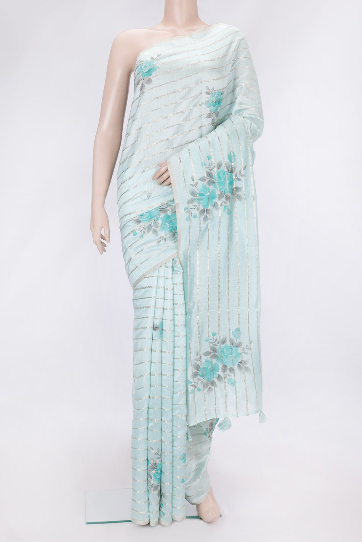 Sky Blue Dual Tone Tussar Silk Saree with Stripes on the body and Zari Border.  displayed on a mannequin