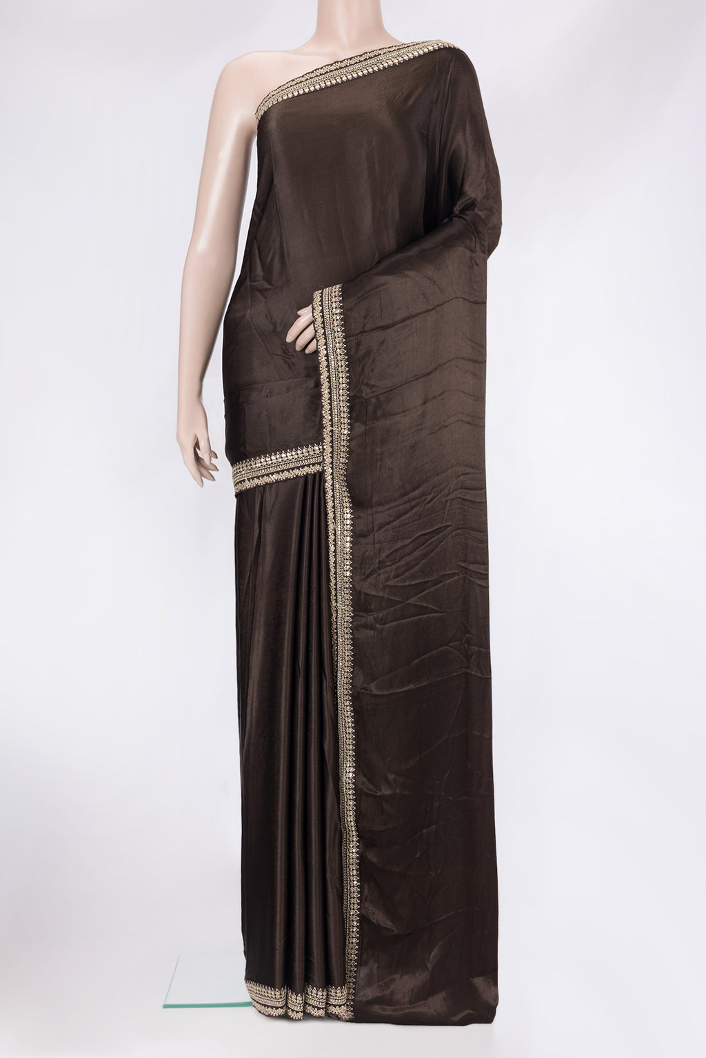 Brown Satin Crepe Saree with Plain Body and Embroidery Border.  displayed on a mannequin