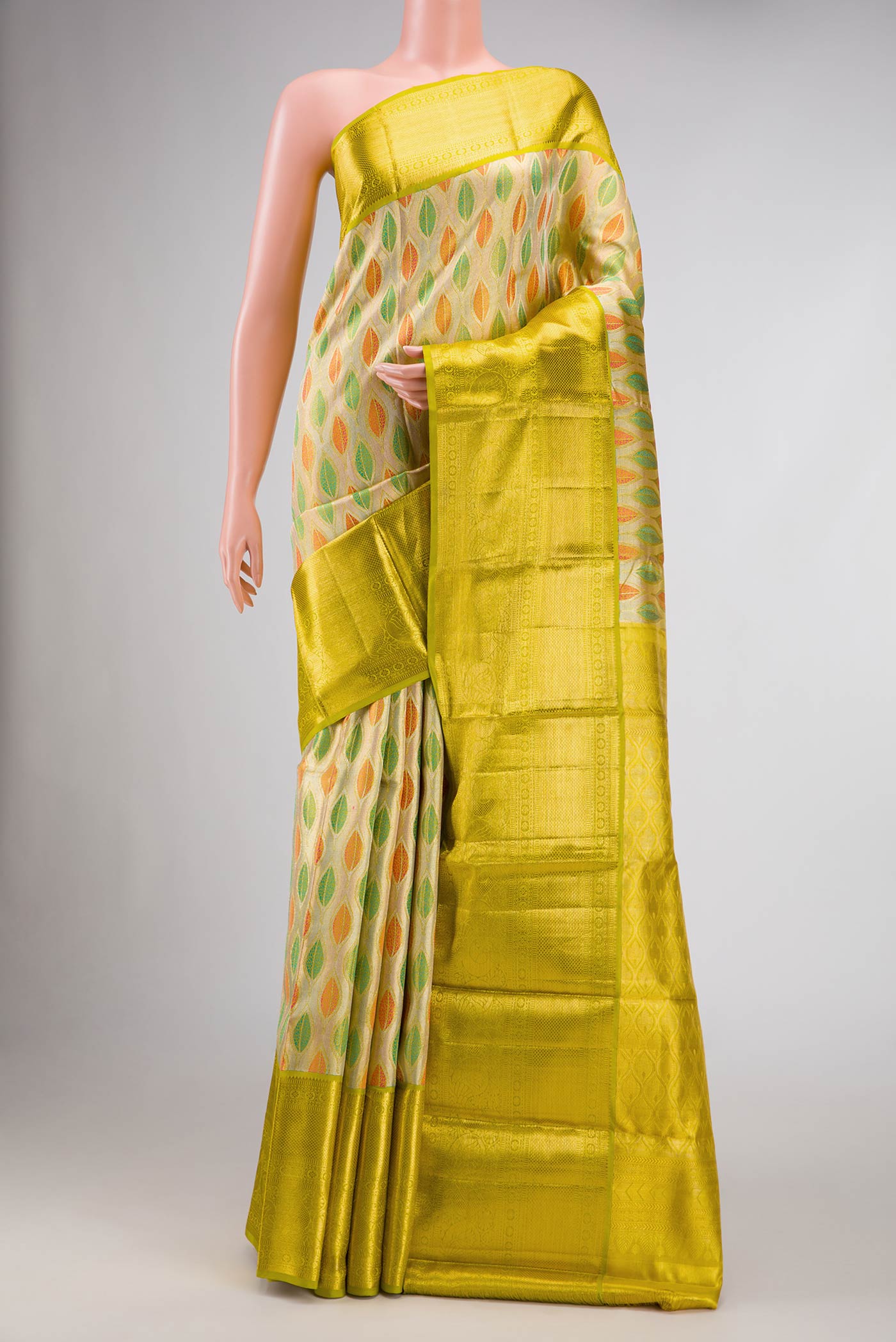 Gold Dual Tone Kanchipuram Tissue Silk Saree with Zari Brocade on the body and Zari Border.  displayed on a mannequin