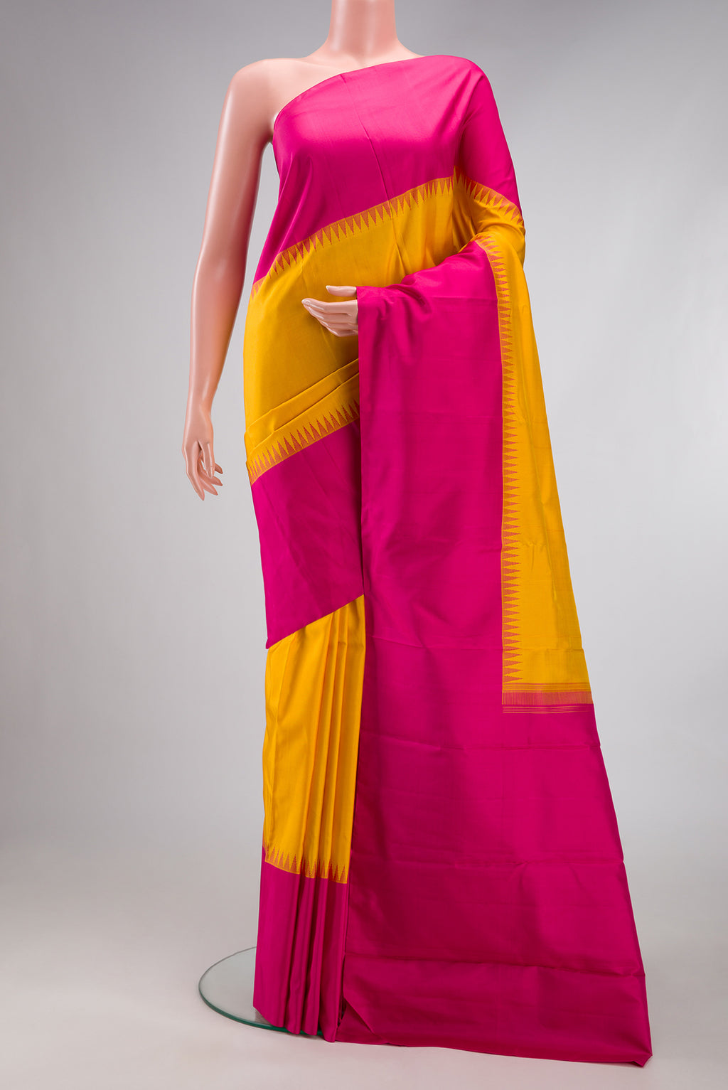 Sandal Dual Tone Kanjivaram Silk Saree with Zari Butta on the body and Zari Border.  displayed on a mannequin