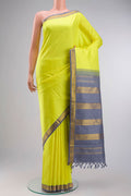 Yellow Kanchipuram Silk Saree with Plain Body and Zari Border displayed on a mannequin
