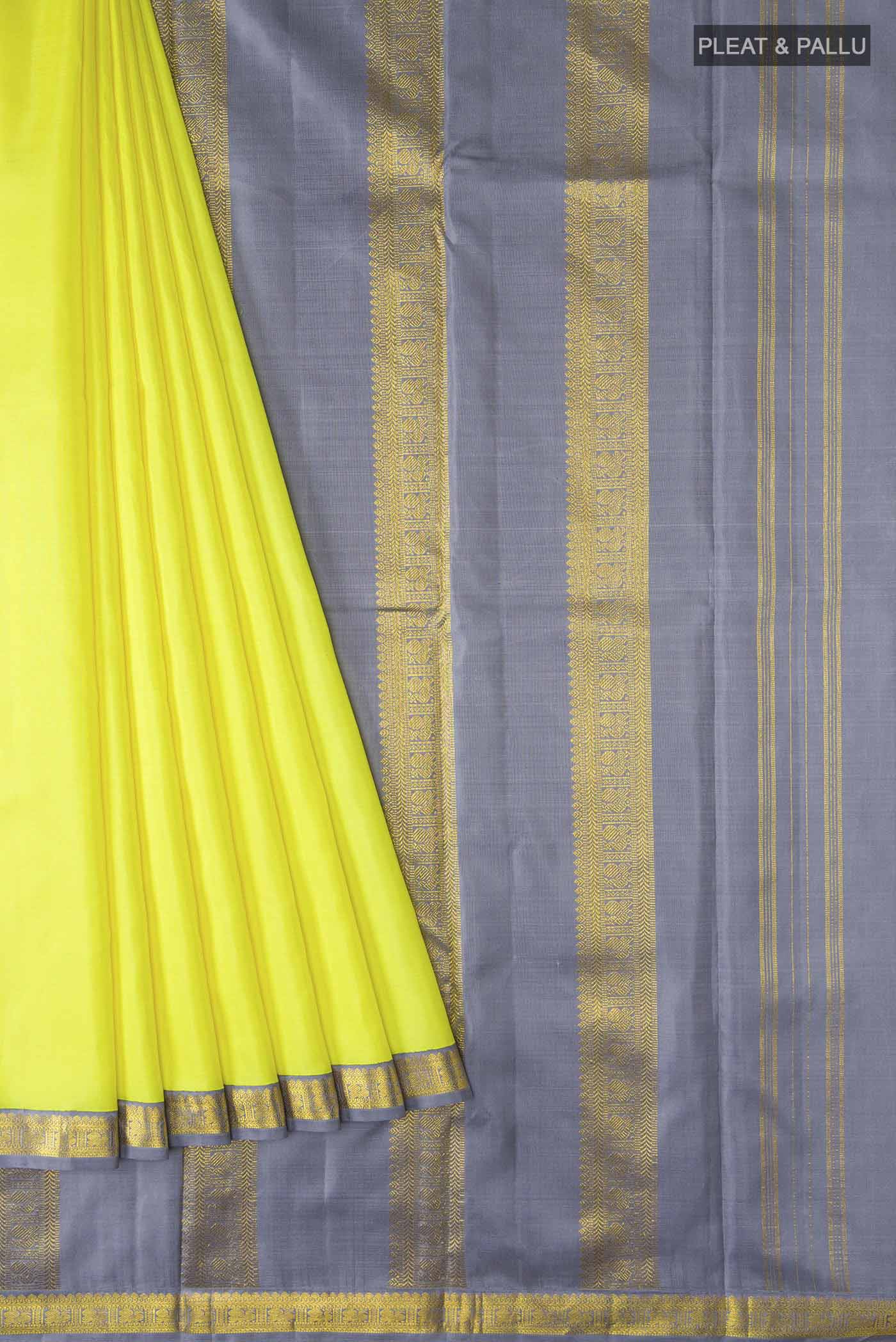 Pleats and pallu of Yellow Kanchipuram Silk Saree with Plain Body and Zari Border