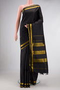 Black Dual Tone Kanjivaram Silk Saree with Plain Body and Zari Border.  displayed on a mannequin