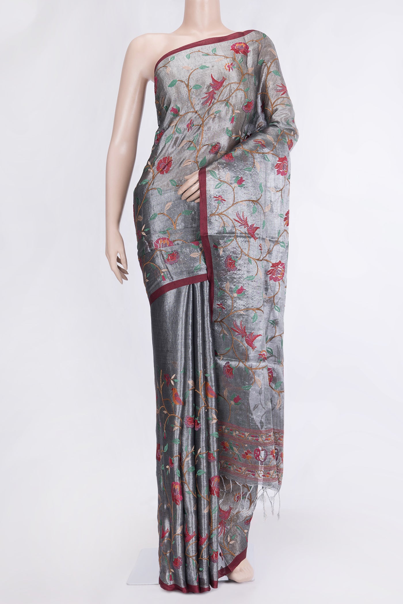 Grey Dual Tone Organza Silk Saree with Embroidery on the body and Zari Border.  displayed on a mannequin