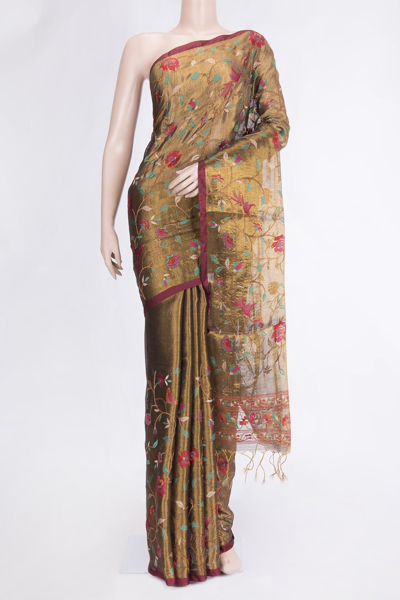 Gold Dual Tone Organza Silk Saree with Embroidery on the body and Zari Border.  displayed on a mannequin