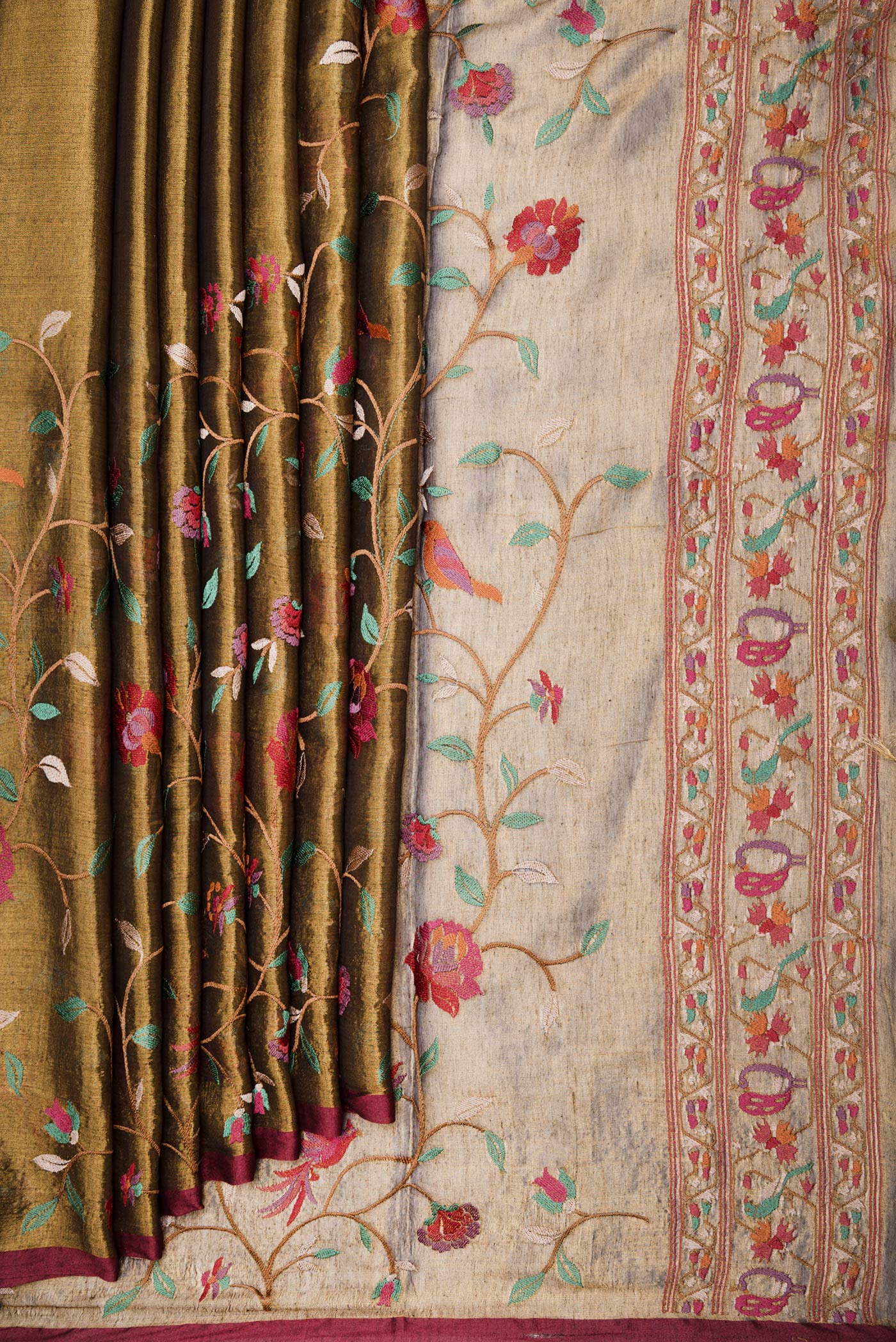 Pleats and pallu of Gold Dual Tone Organza Silk Saree with Embroidery on the body and Zari Border. 