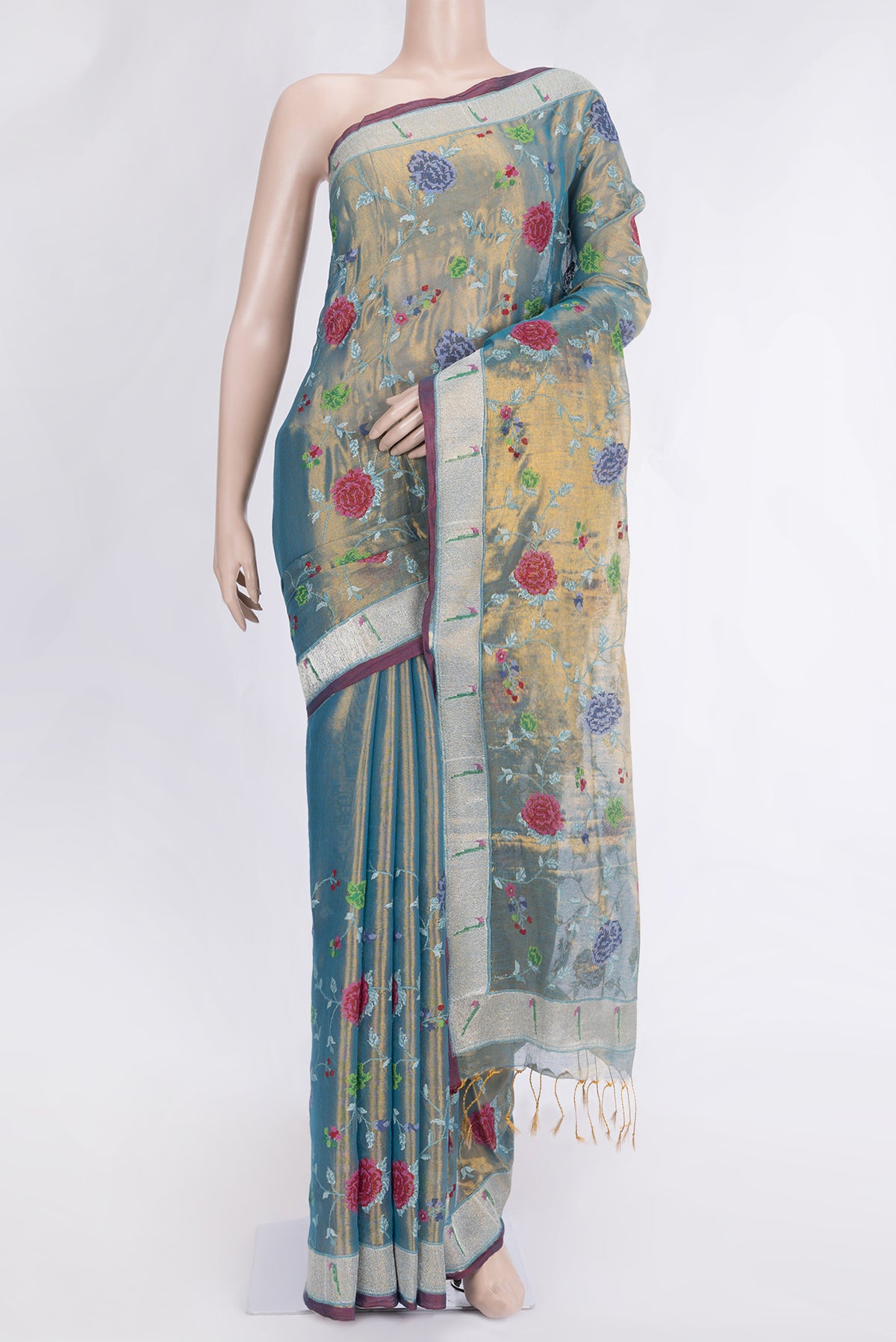 Pista Green Dual Tone Organza Silk Saree with Embroidery on the body and Zari Border.  displayed on a mannequin