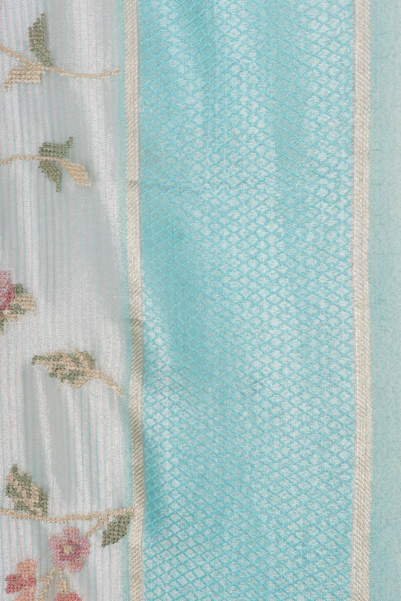 Border image of Sea Green Dual Tone Organza Silk Saree with Embroidery on the body and Zari And Thread Border. 