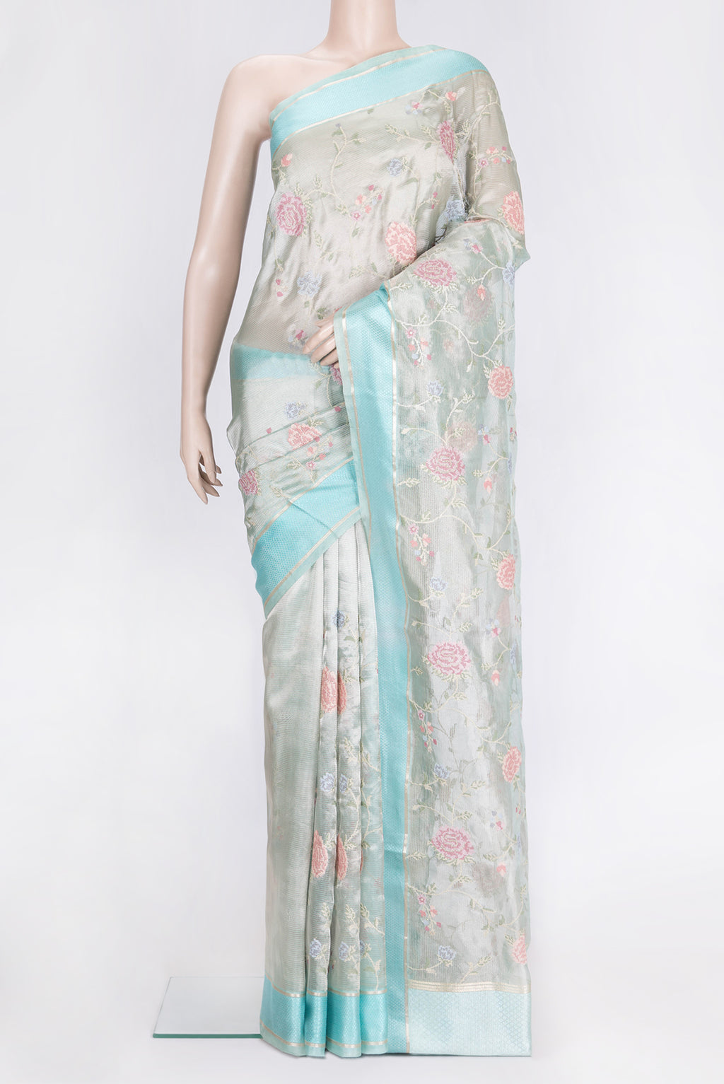 Sea Green Dual Tone Organza Silk Saree with Embroidery on the body and Zari And Thread Border.  displayed on a mannequin
