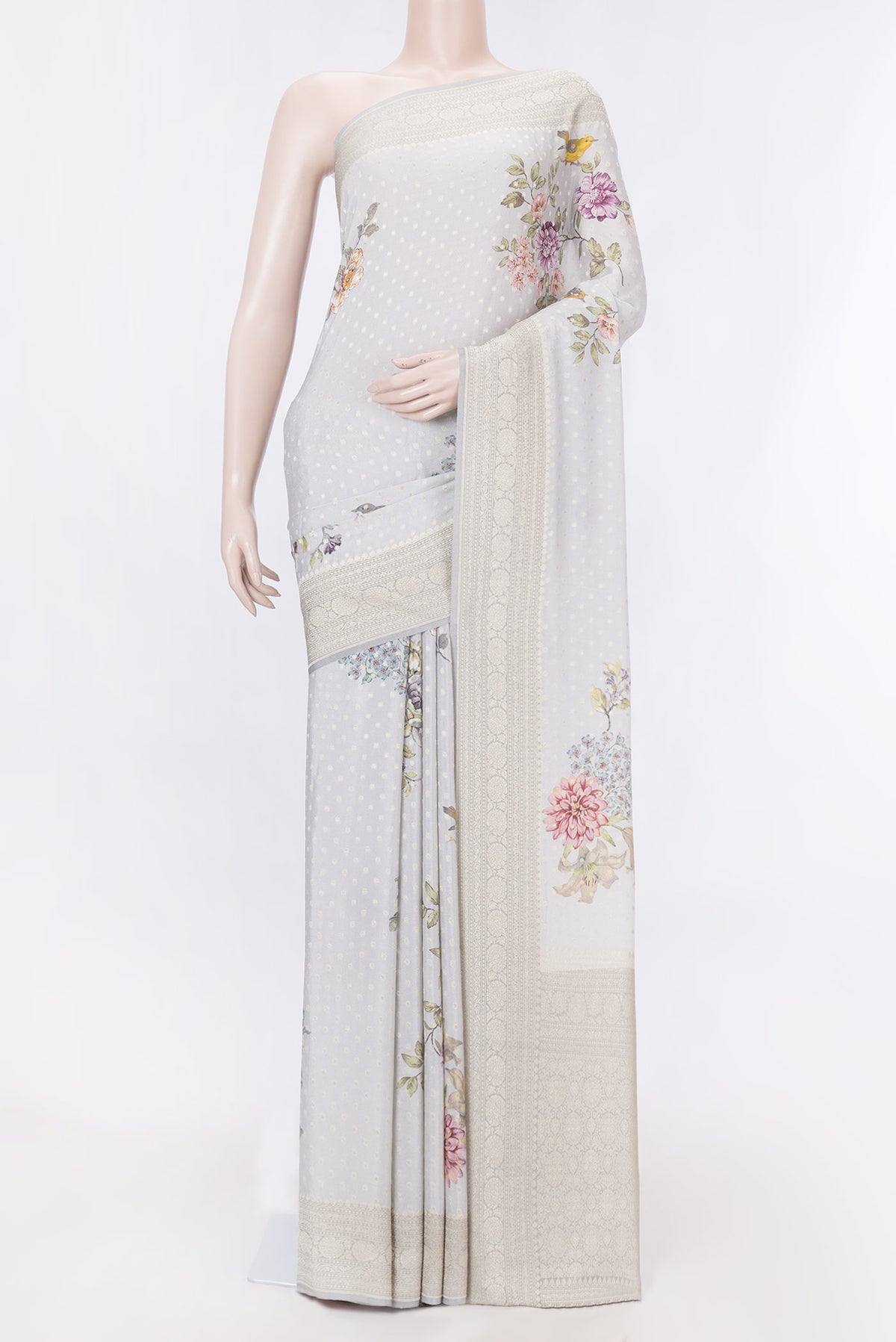 Grey Dual Tone Mysore Georgette Saree with Zari Butta on the body and Zari Border displayed on a mannequin