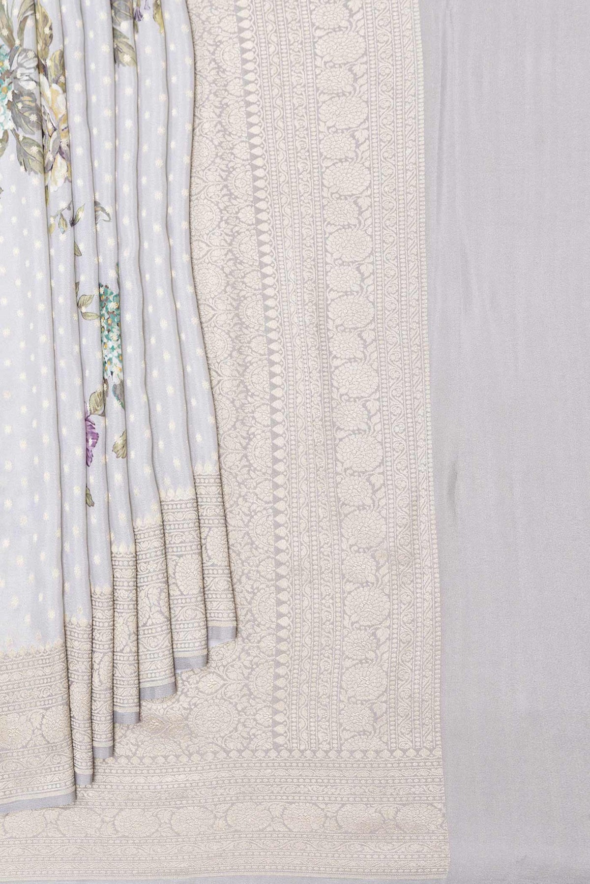Pleats and pallu of Grey Dual Tone Mysore Georgette Saree with Zari Butta on the body and Zari Border