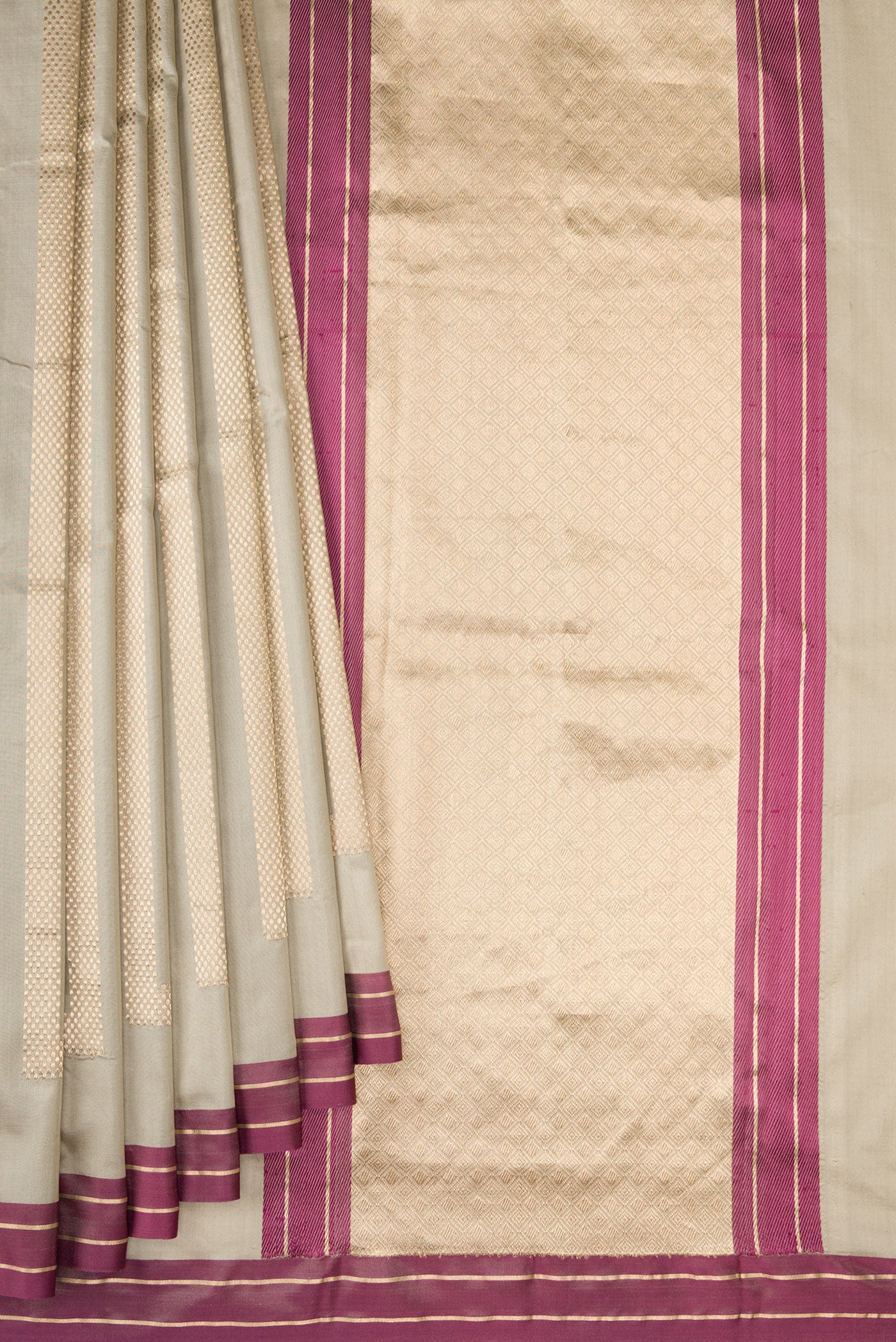 Pleats and pallu of Beige Banarasi Silk Saree with Stripes on the body and Zari Border. 