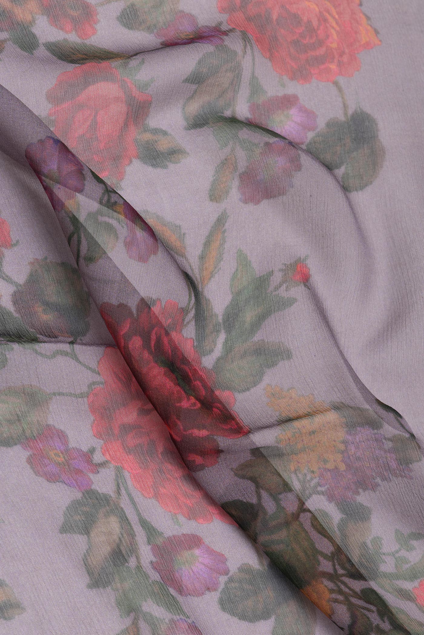 Close up of Purple Dual Tone Chiffon Saree with Floral Print on the body and Zari Border.  displaying folds