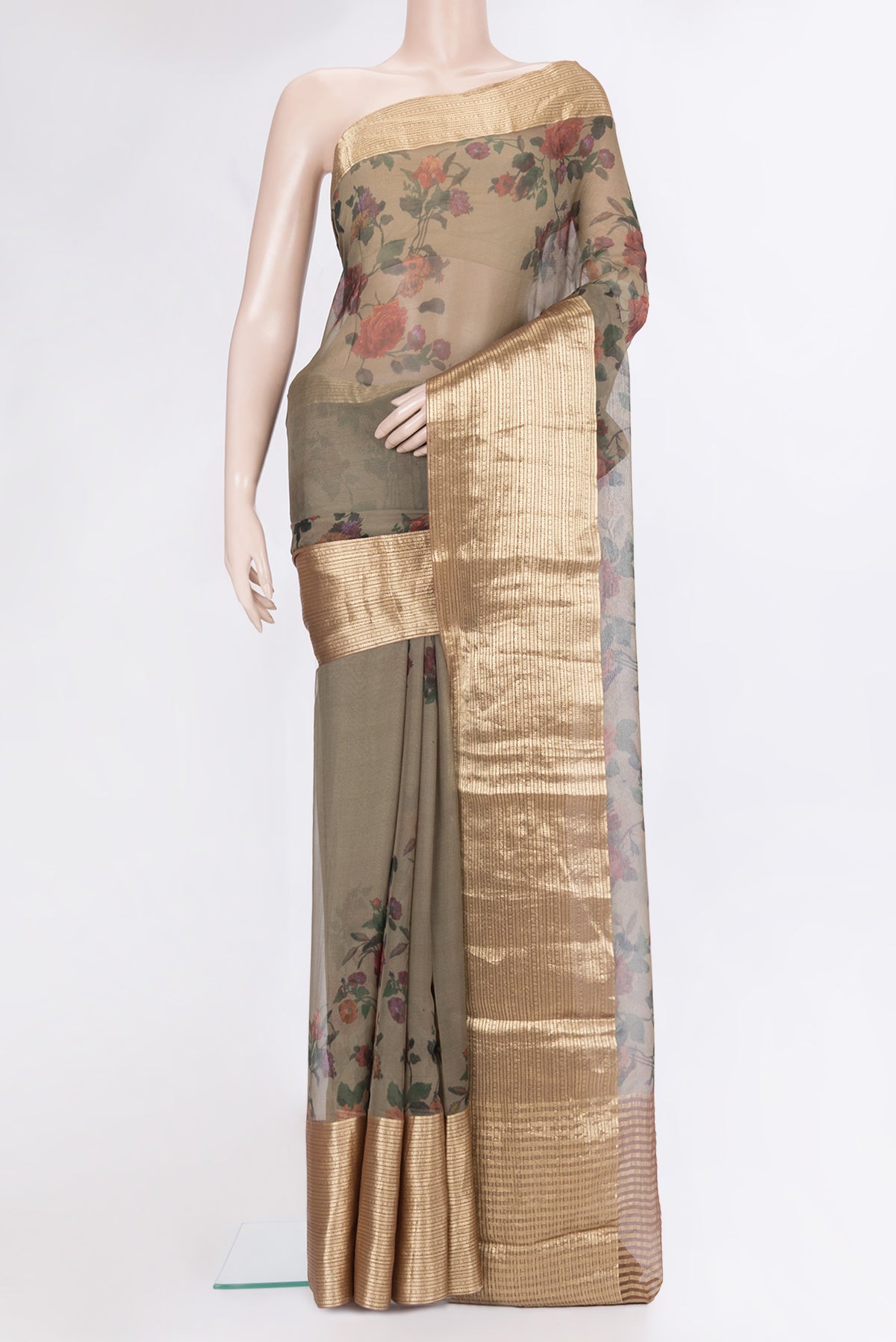 Mehandi Green Chiffon Saree with Floral Print on the body and Zari Border.  displayed on a mannequin