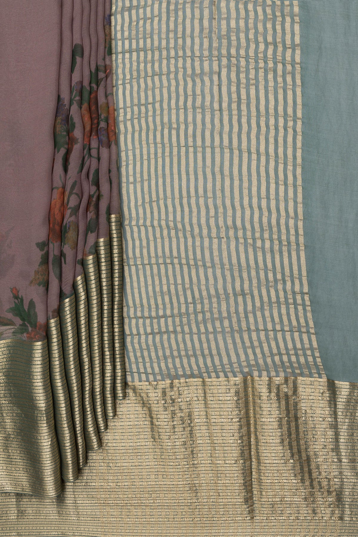 Pleats and pallu of Brown Chiffon Saree with Printed design on the body and Zari Border. 