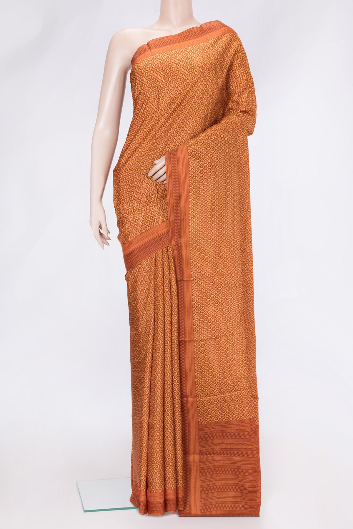 Peach Dual Tone Printed Silk Saree with Printed design on the body and Printed Border.  displayed on a mannequin