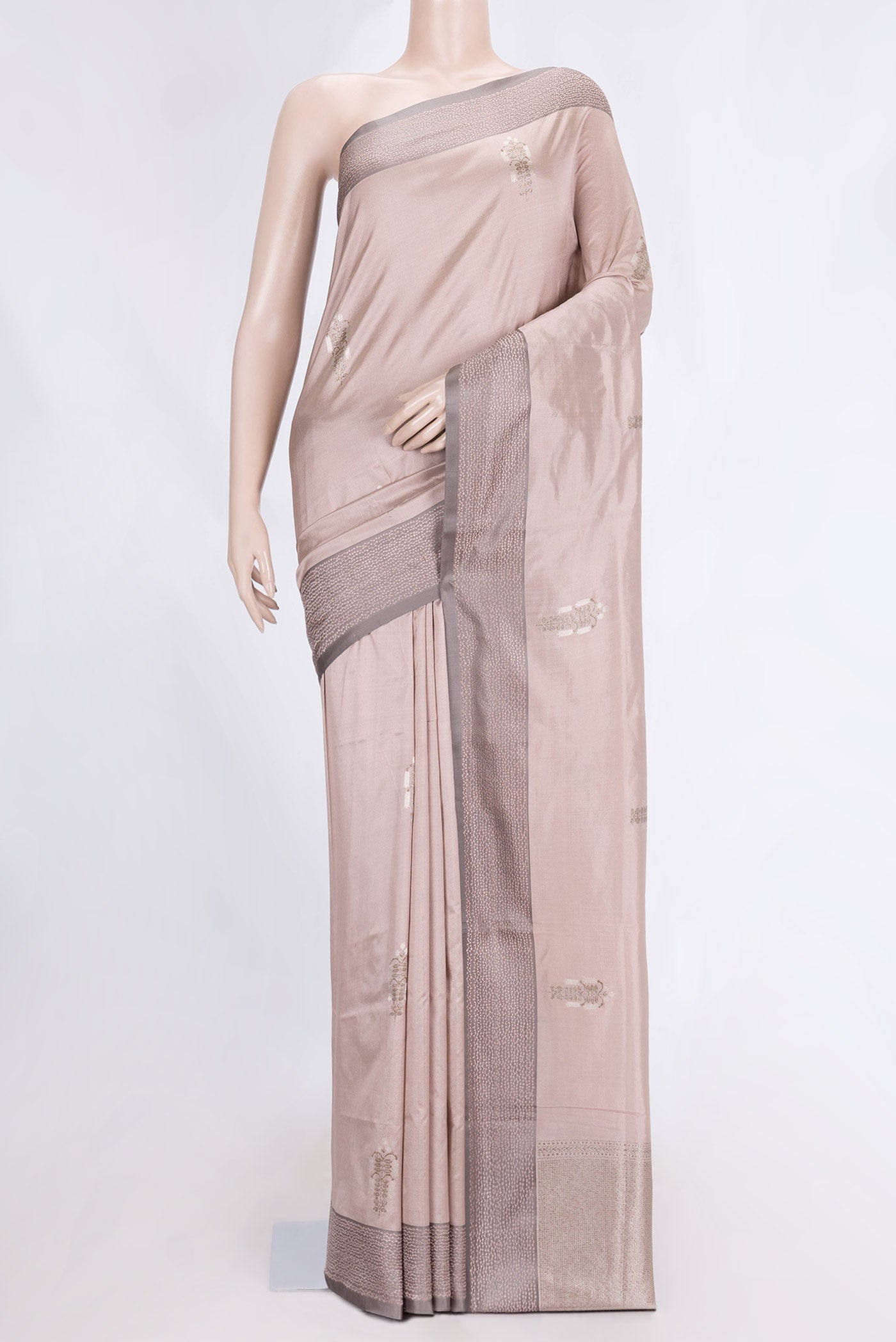Rose Gold Dual Tone Banarasi Silk Saree with Zari Butta on the body and Zari Border.  displayed on a mannequin
