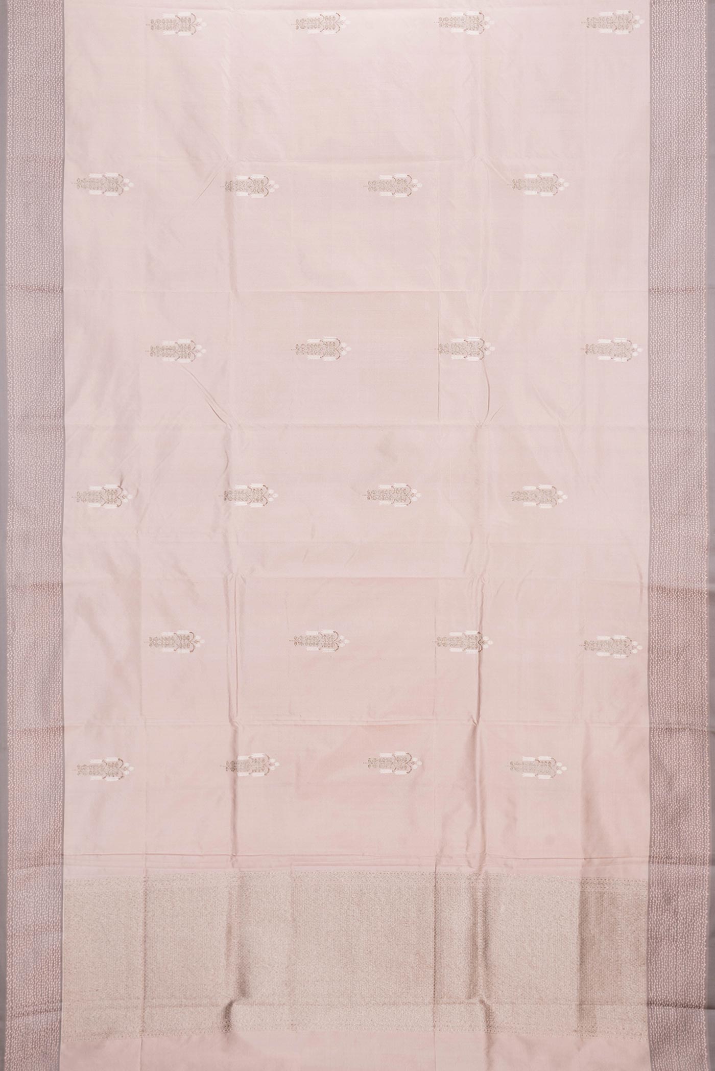 Flat view of Rose Gold Dual Tone Banarasi Silk Saree with Zari Butta on the body and Zari Border. 