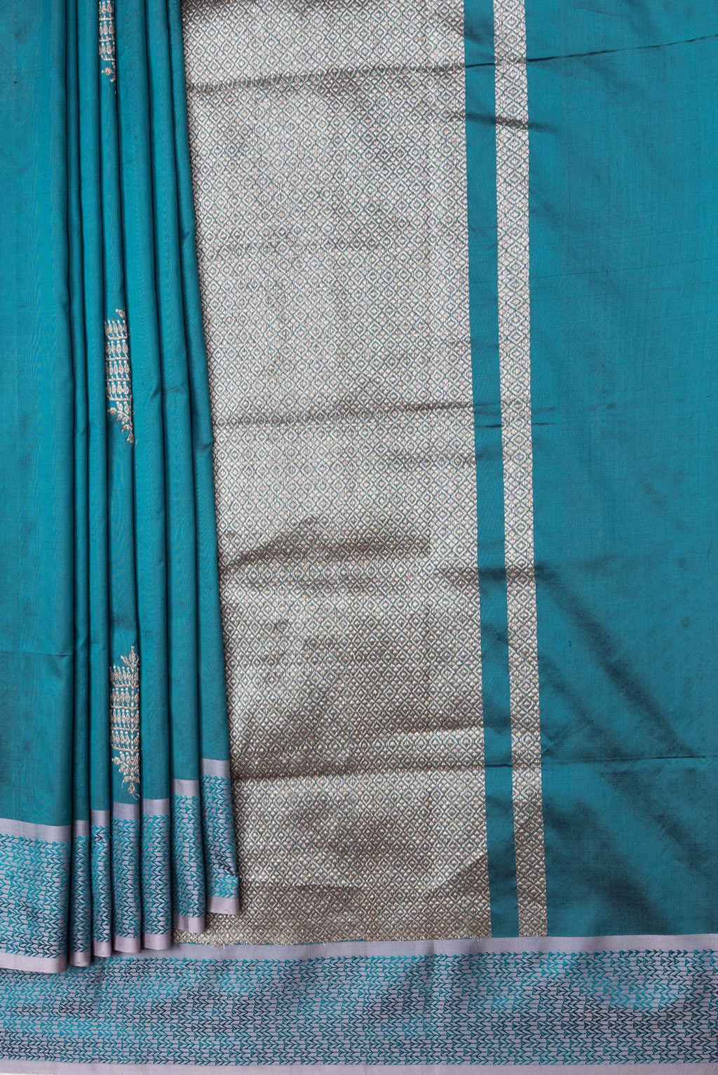 Pleats and pallu of Peacock Blue Dual Tone Banarasi Silk Saree with Zari Butta on the body and Thread Border. 