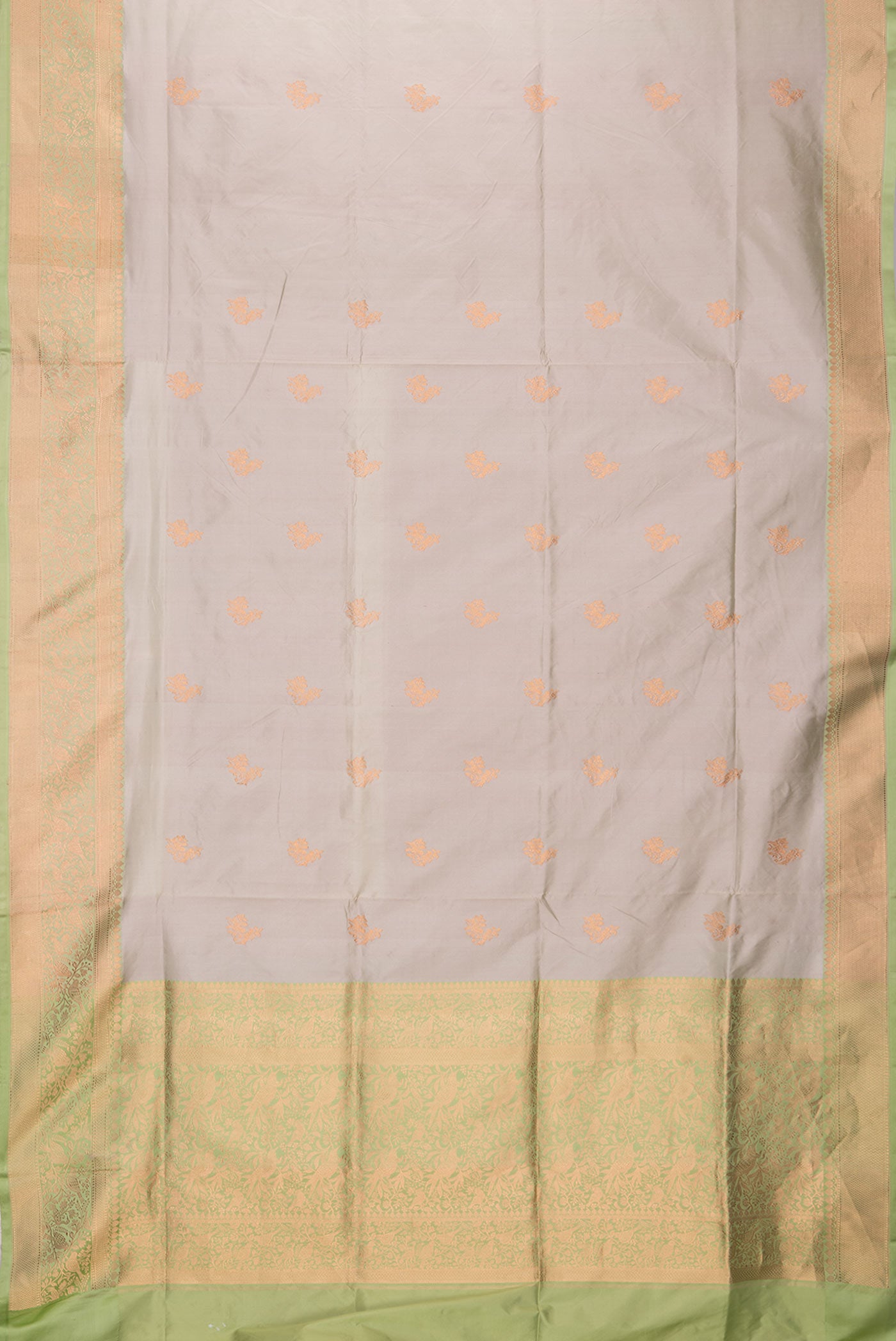 Flat view of Beige Dual Tone Banarasi Silk Saree with Zari Butta on the body and Zari Border. 