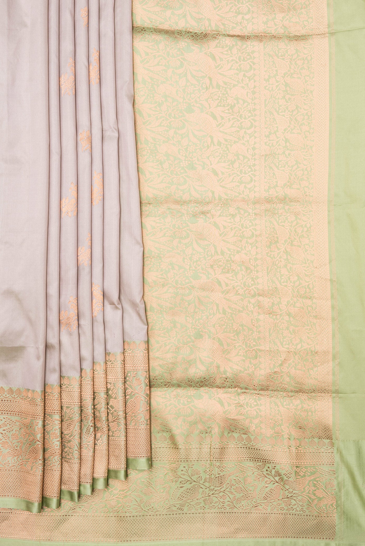 Pleats and pallu of Beige Dual Tone Banarasi Silk Saree with Zari Butta on the body and Zari Border. 