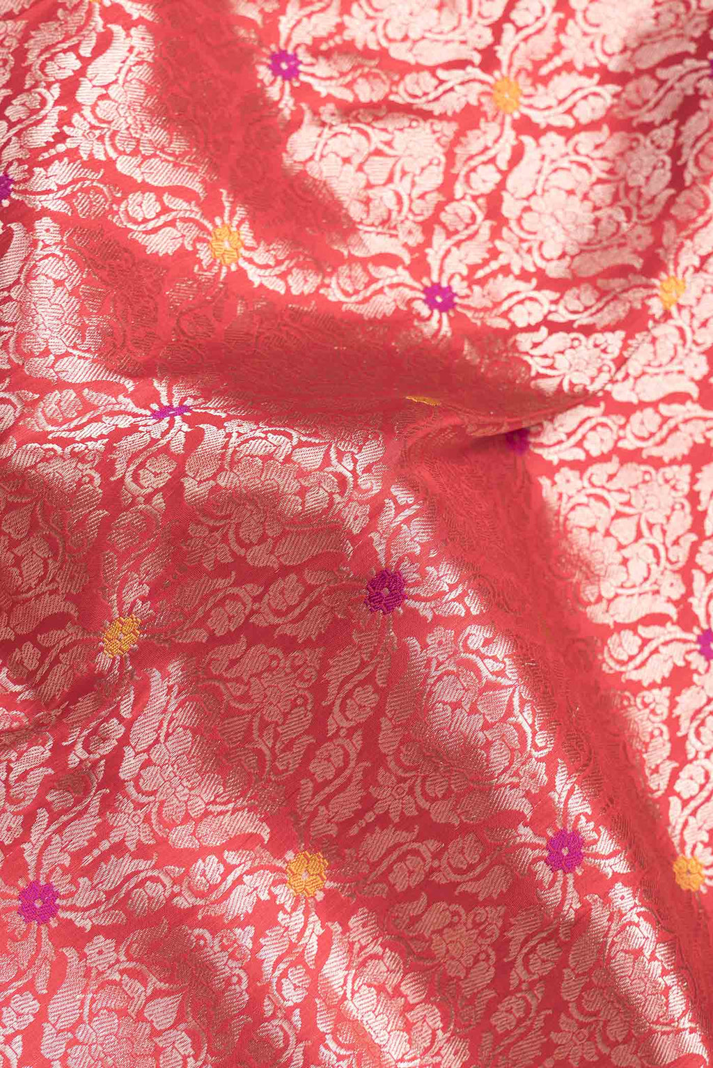 Close up of Red Dual Tone Banarasi Silk Saree with Zari Brocade on the body and Zari Border.  displaying folds