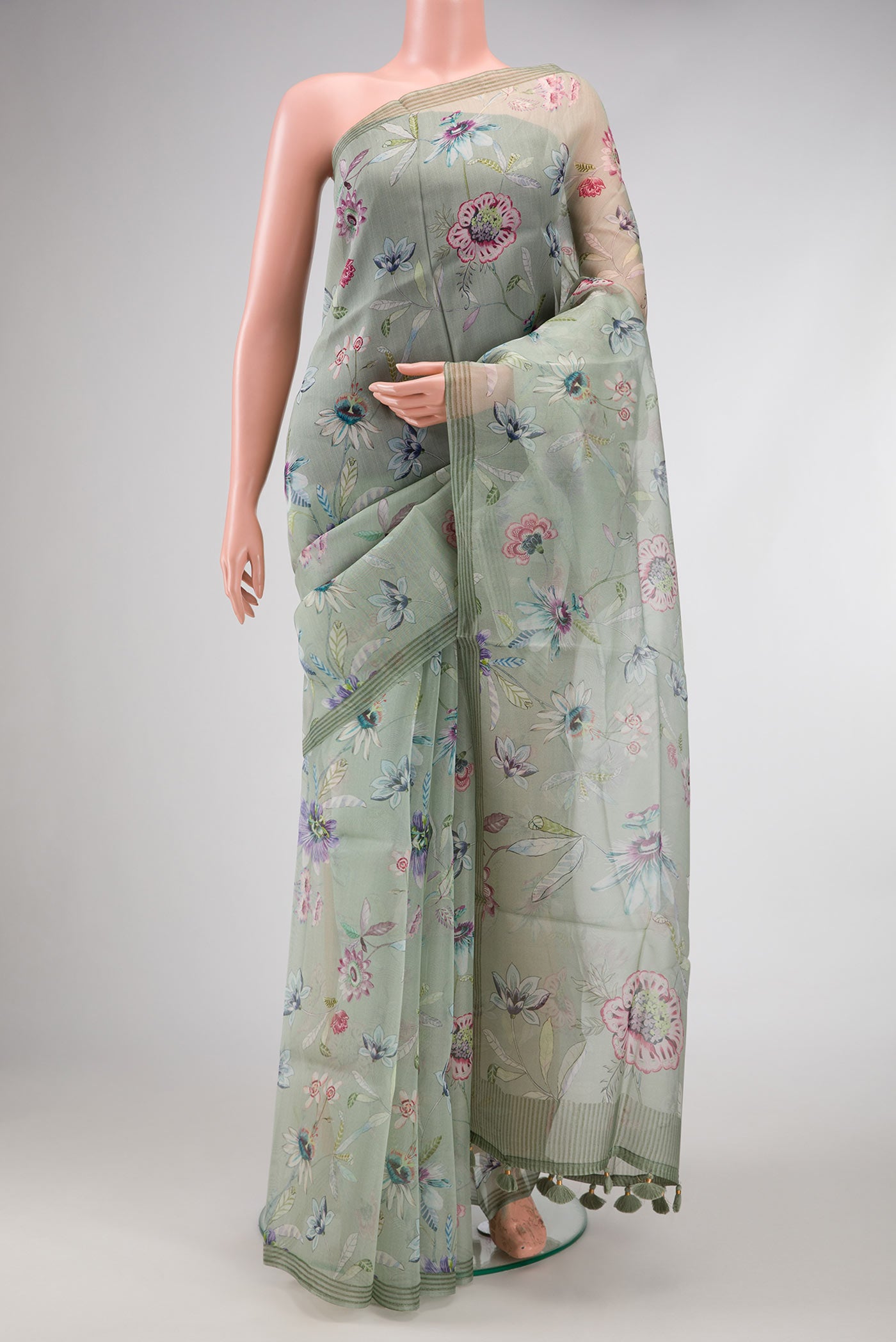 Green Dual Tone Organza Silk Saree with Printed design on the body and Printed Border.  displayed on a mannequin