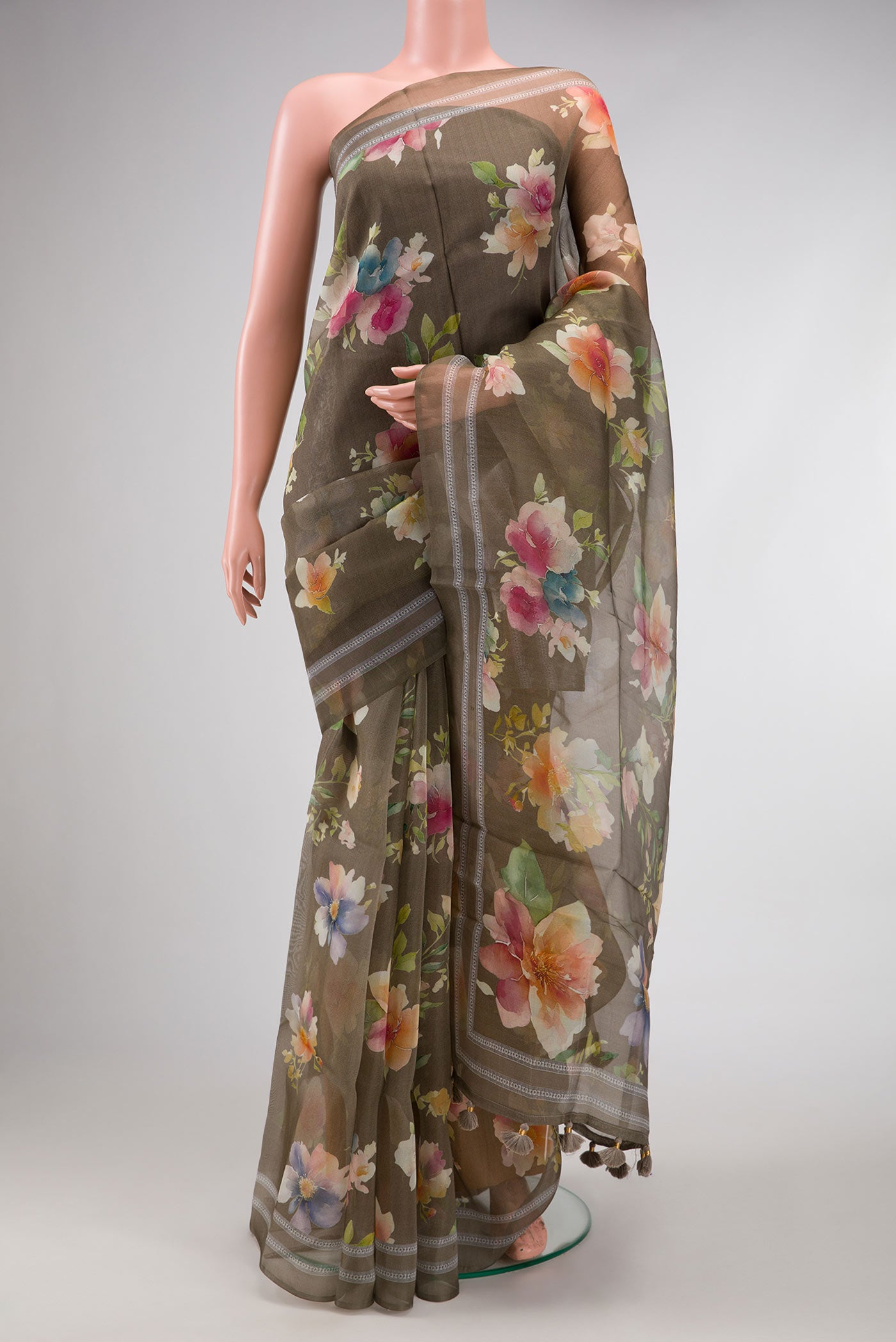 Green Dual Tone Organza Silk Saree with Printed design on the body and Printed Border.  displayed on a mannequin