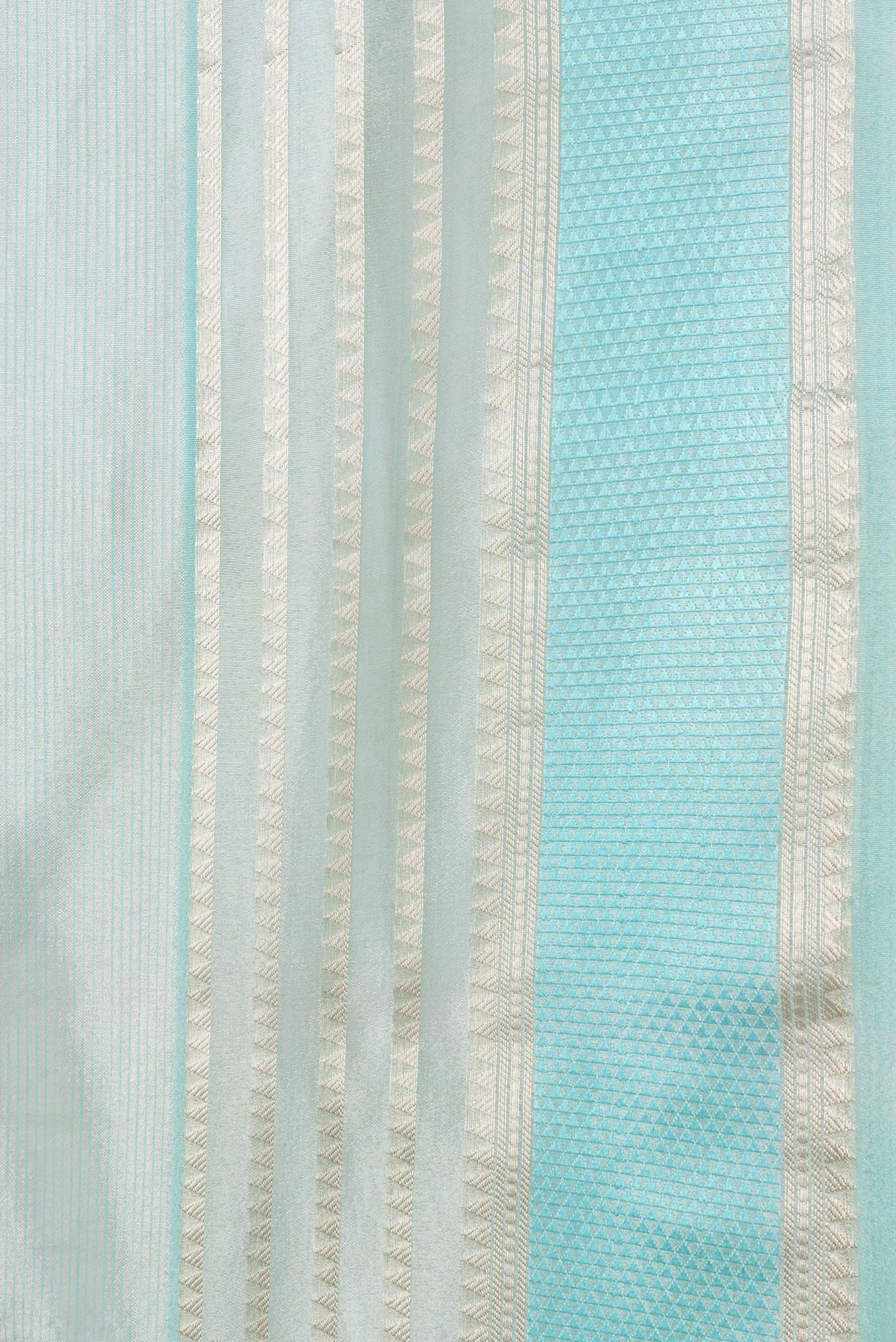 Border image of Sea Green Dual Tone Organza Silk Saree with Embroidery on the body and Zari And Thread Border. 