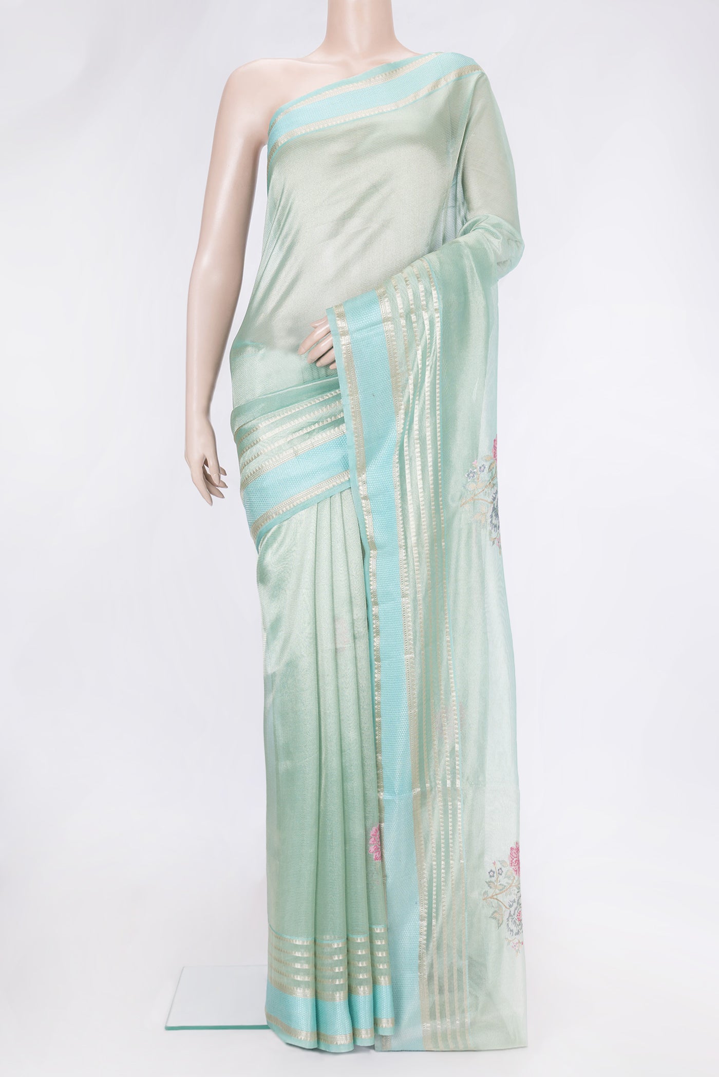 Sea Green Dual Tone Organza Silk Saree with Embroidery on the body and Zari And Thread Border.  displayed on a mannequin