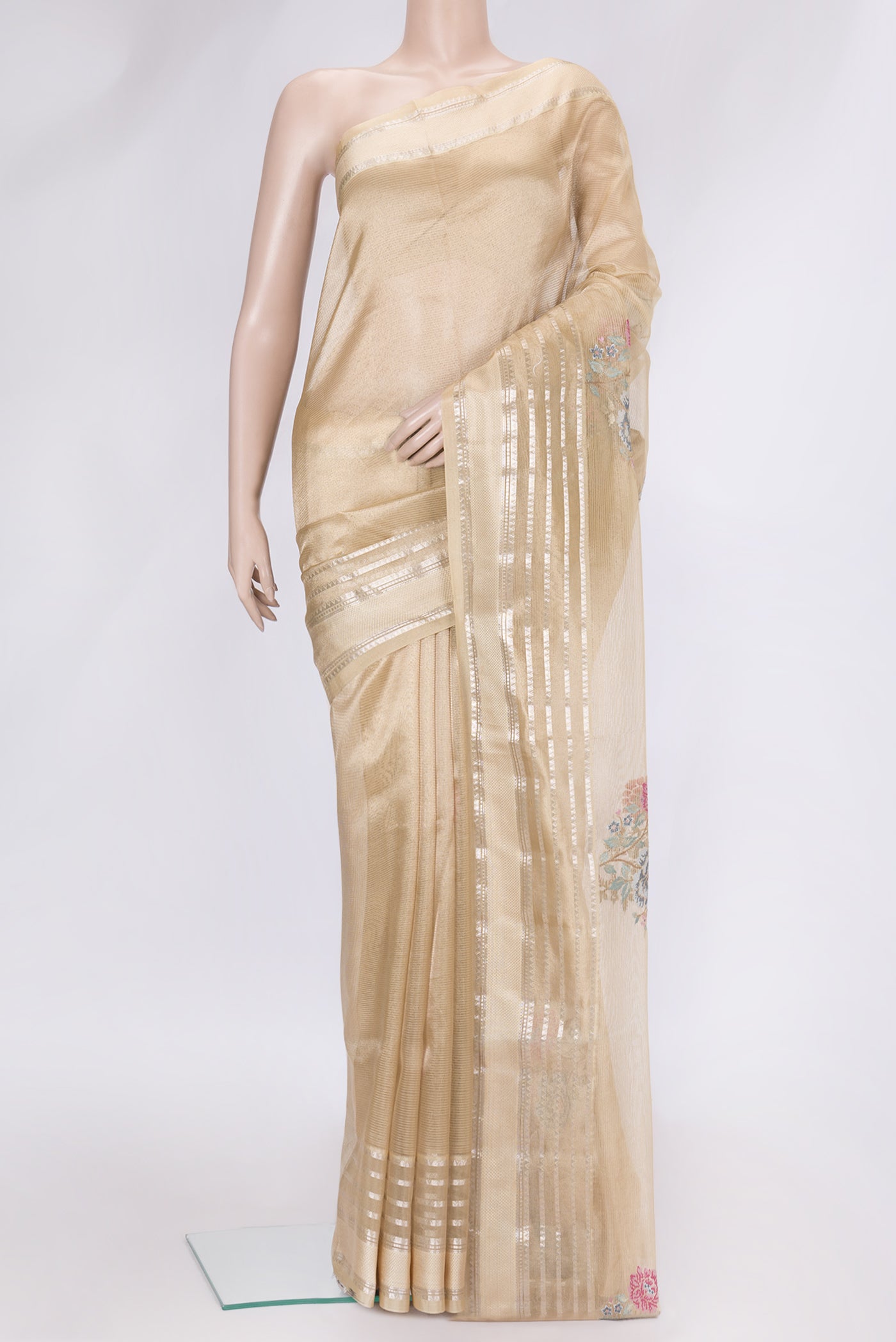 Gold Dual Tone Organza Silk Saree with Embroidery on the body and Zari Border.  displayed on a mannequin